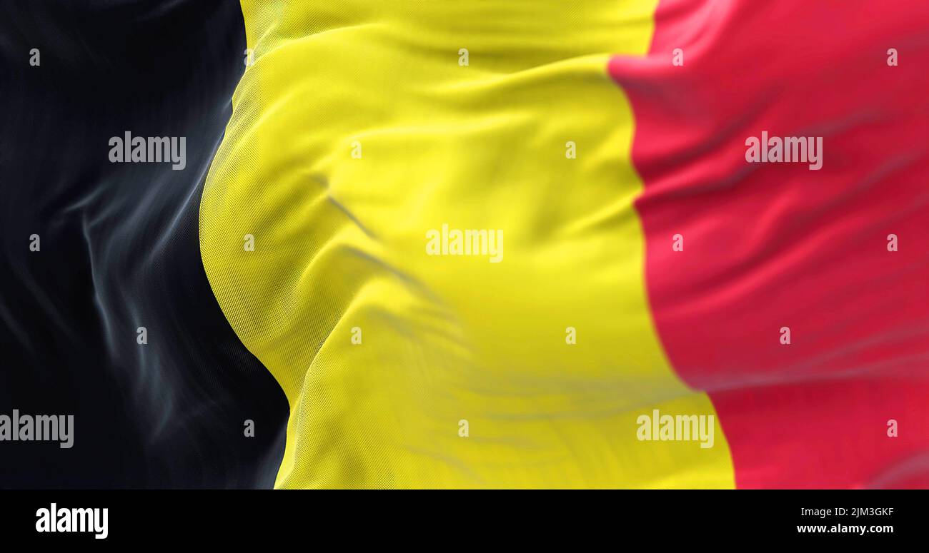 Close-up view of the belgian national flag waving in the wind. Belgium is a country in Northwestern Europe. Fabric textured background. Selective focu Stock Photo