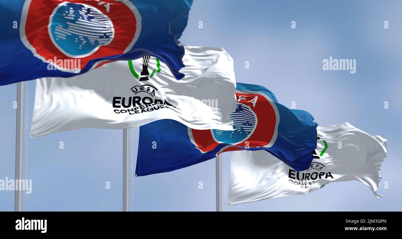 Prague, Czech rep, July 2022: Flags with UEFA and UEFA Europa Conference League waving in the wind. Europa Conference League is an annual football clu Stock Photo