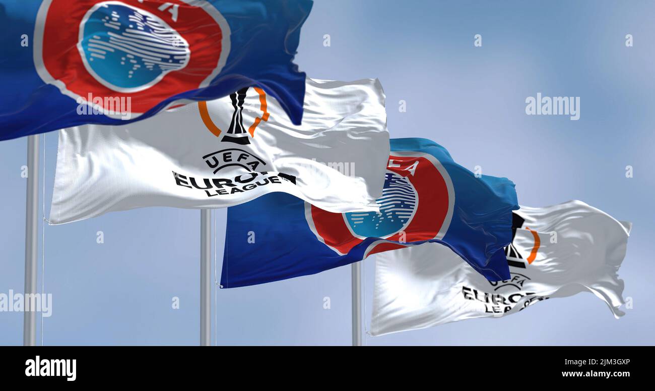 Budapest HUN, July 2022: Flags with UEFA and UEFA Europa League waving in the wind. Europa League is an annual football club competition for european Stock Photo