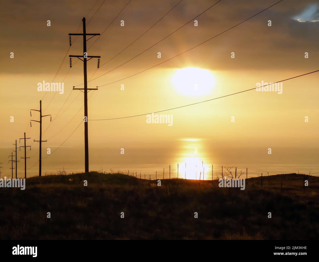 The golden sunset over transmission towers Stock Photo - Alamy