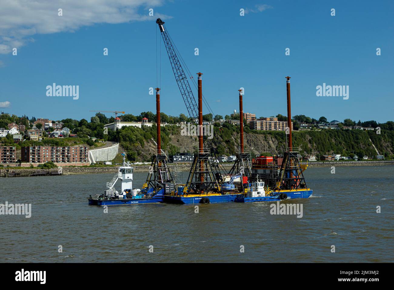 A barge is seen on the St-Lawrence River between Quebec City and Levis to do preliminary works for the tunnel that will link the two cities Friday Jul Stock Photo