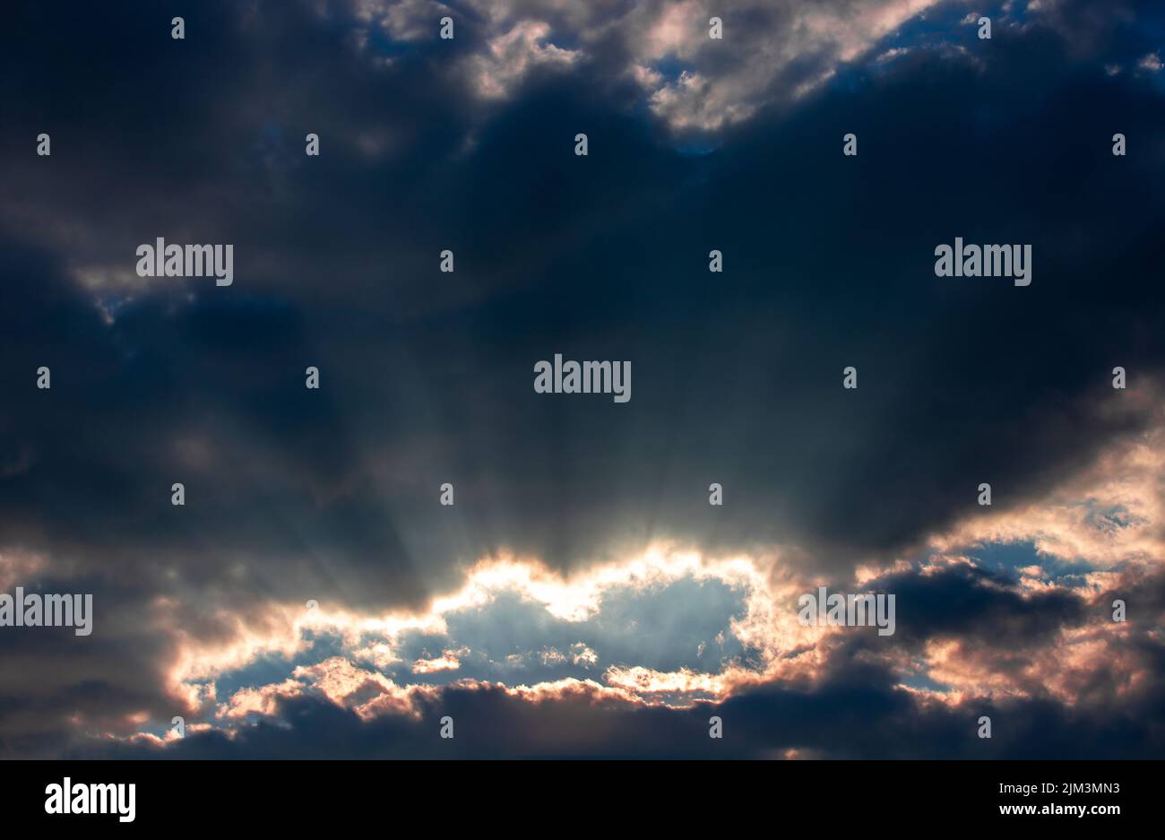 Sun rays through hole in clouds hi-res stock photography and images - Alamy