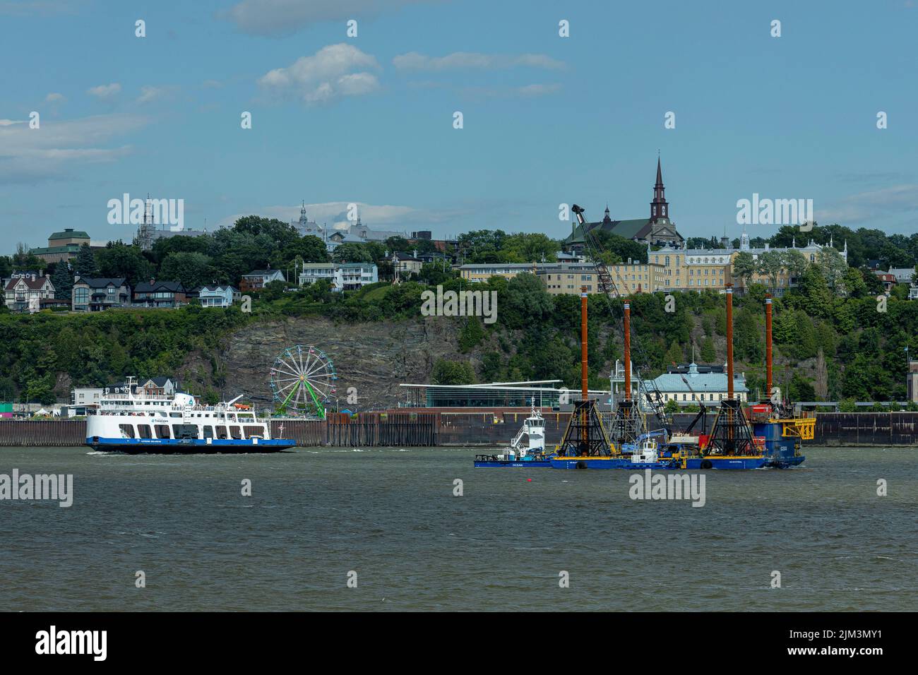 A barge is seen on the St-Lawrence River between Quebec City and Levis to do preliminary works for the tunnel that will link the two cities Friday Jul Stock Photo