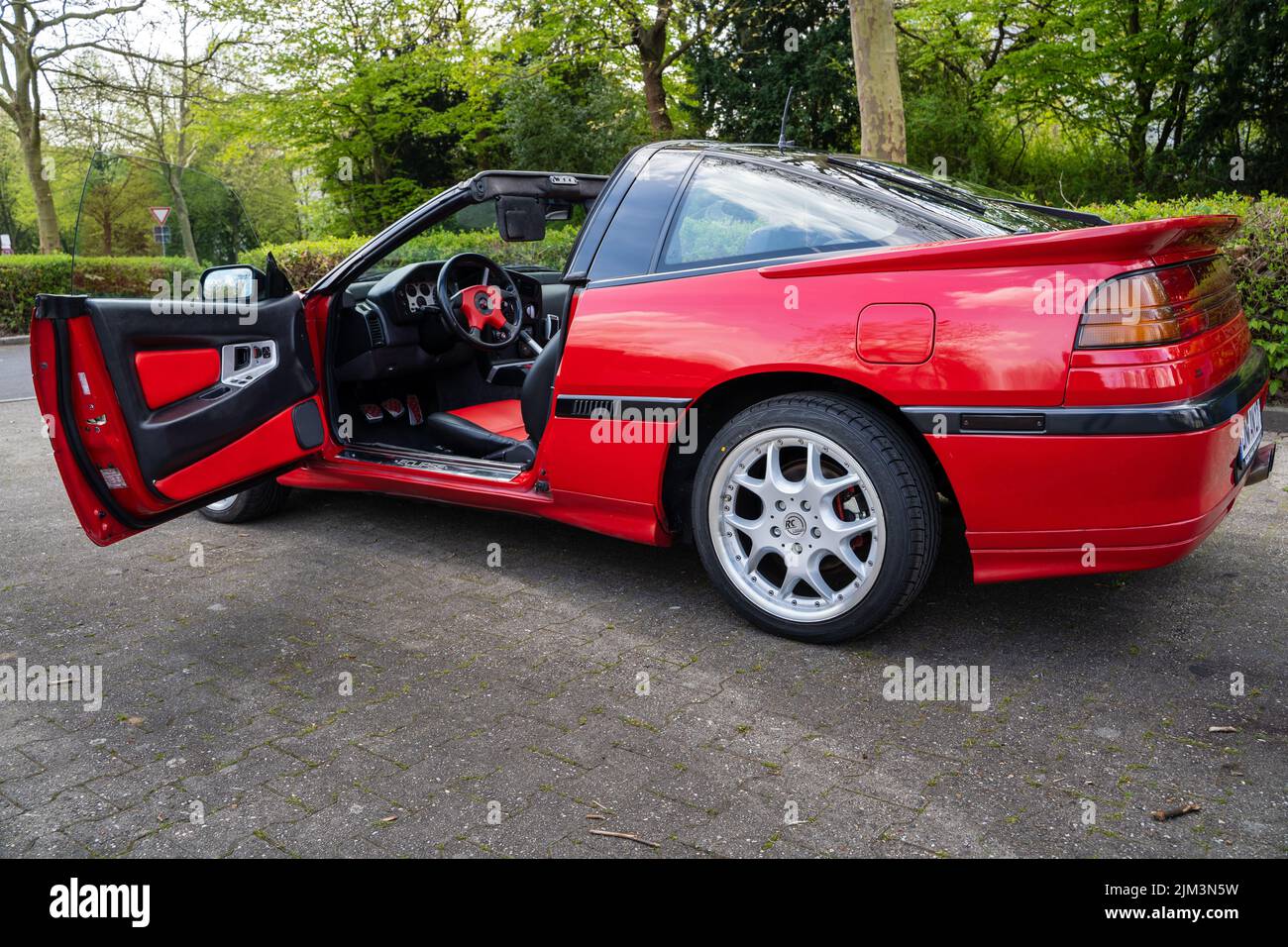 mitsubishi eclipse targa in red. It's an old car with a targa roof. Stock Photo