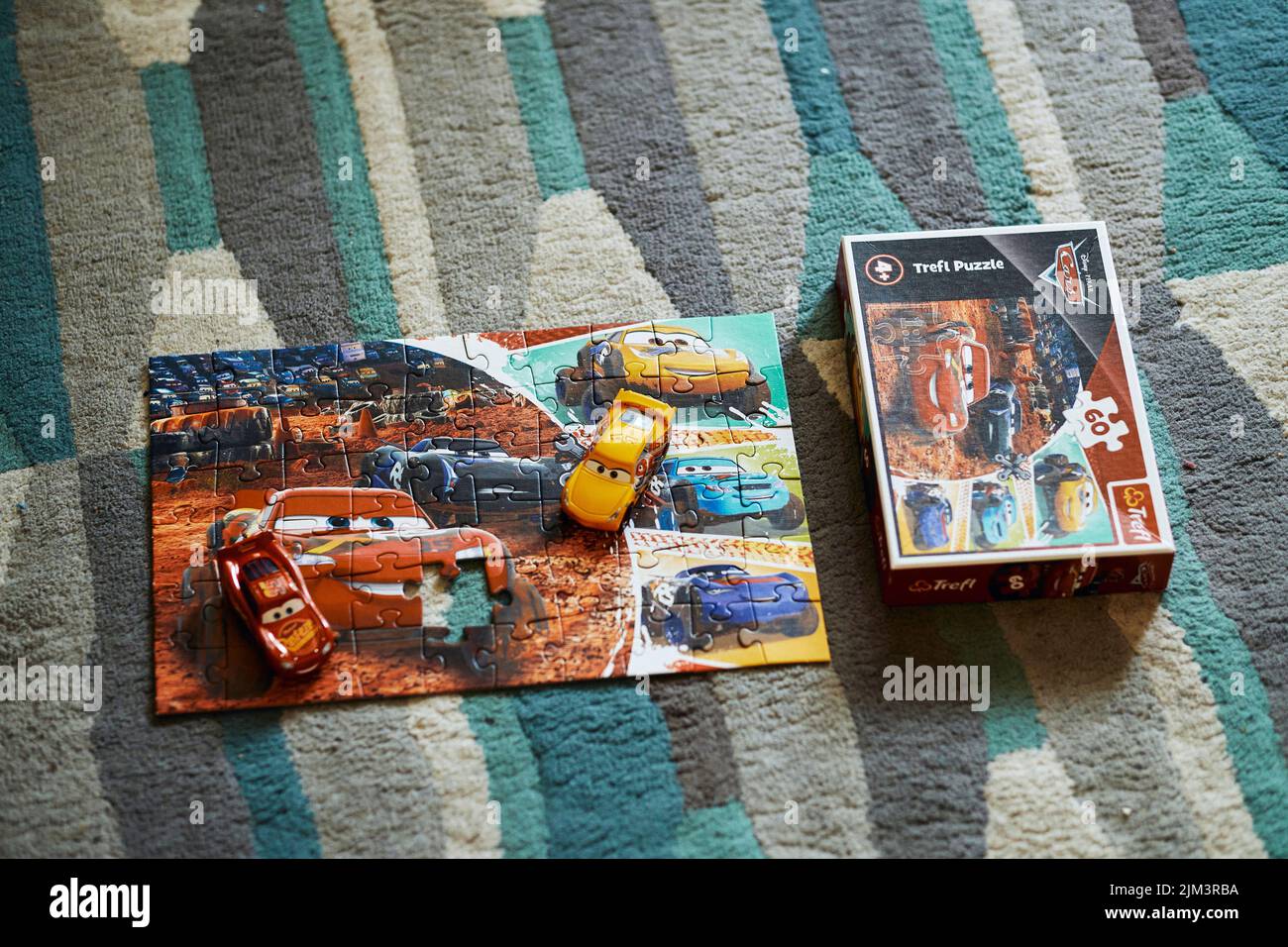 The Mattel Cruz Ramirez and Lightning McQueen on a Trefl Disney Pixar ...