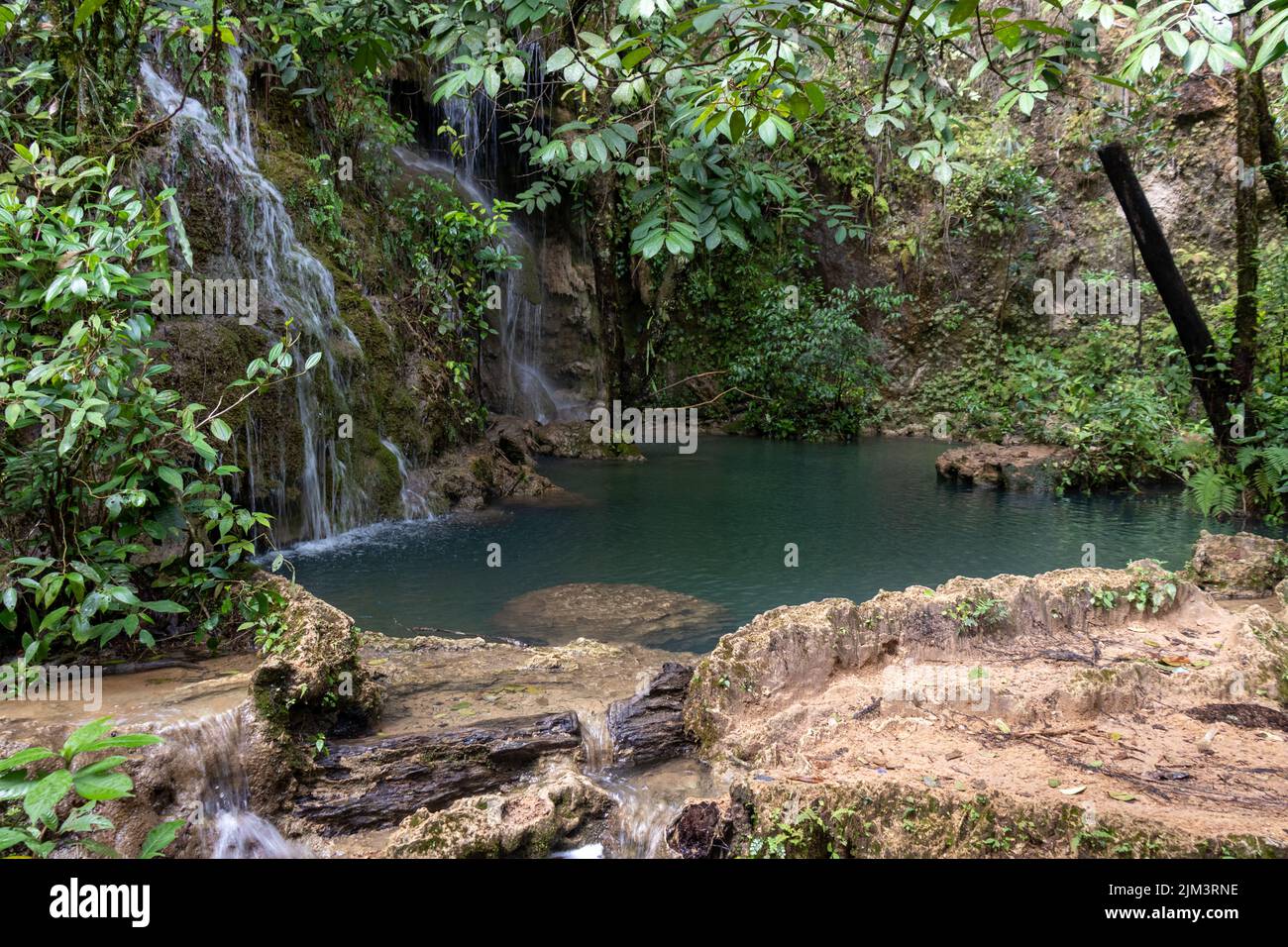 Waterfall at laguna brava in huehuetenango guatemala with little green pond. Stock Photo