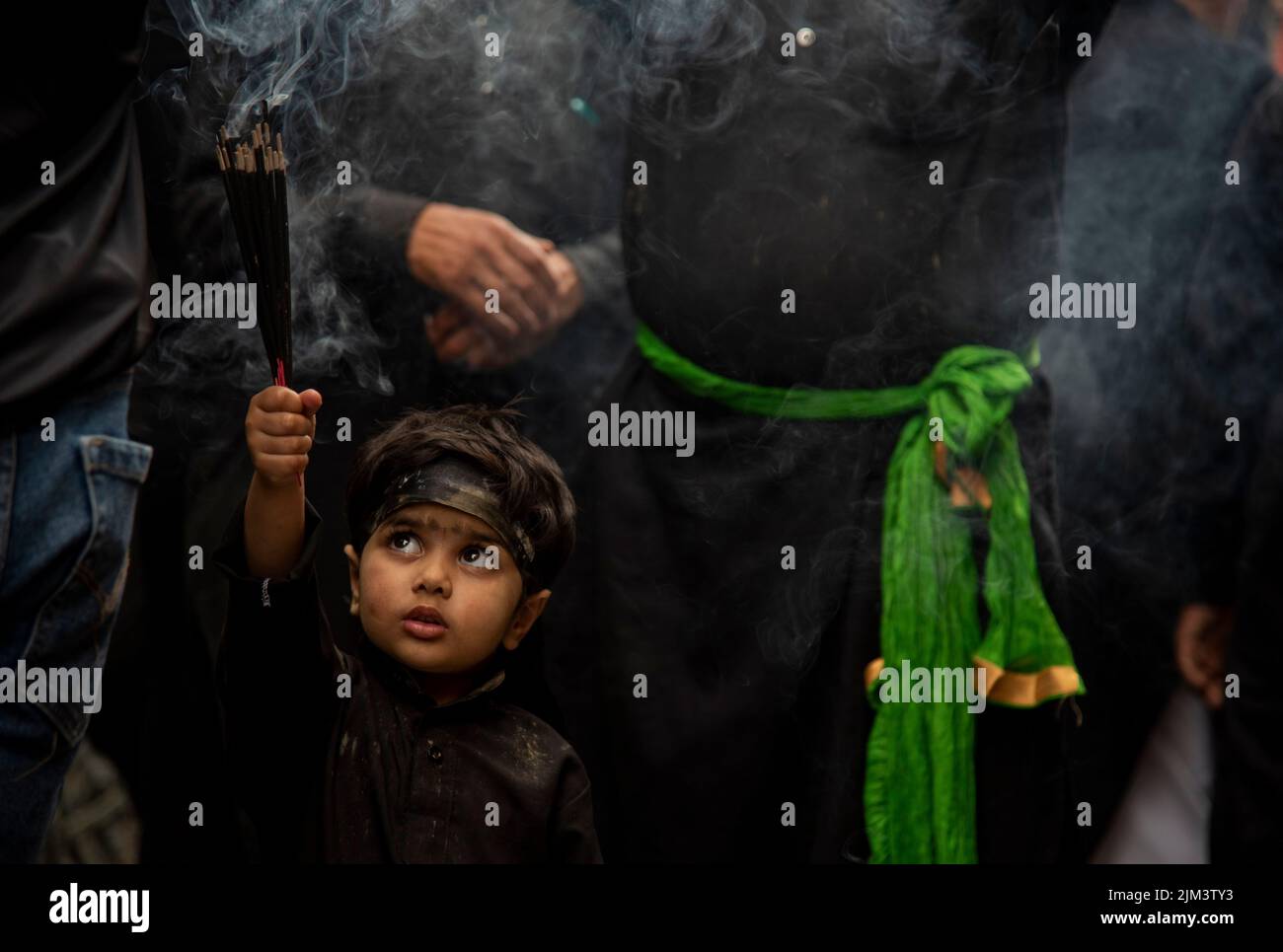 Srinagar, India. 04th Aug, 2022. A Kashmiri Shia Muslim boy holds