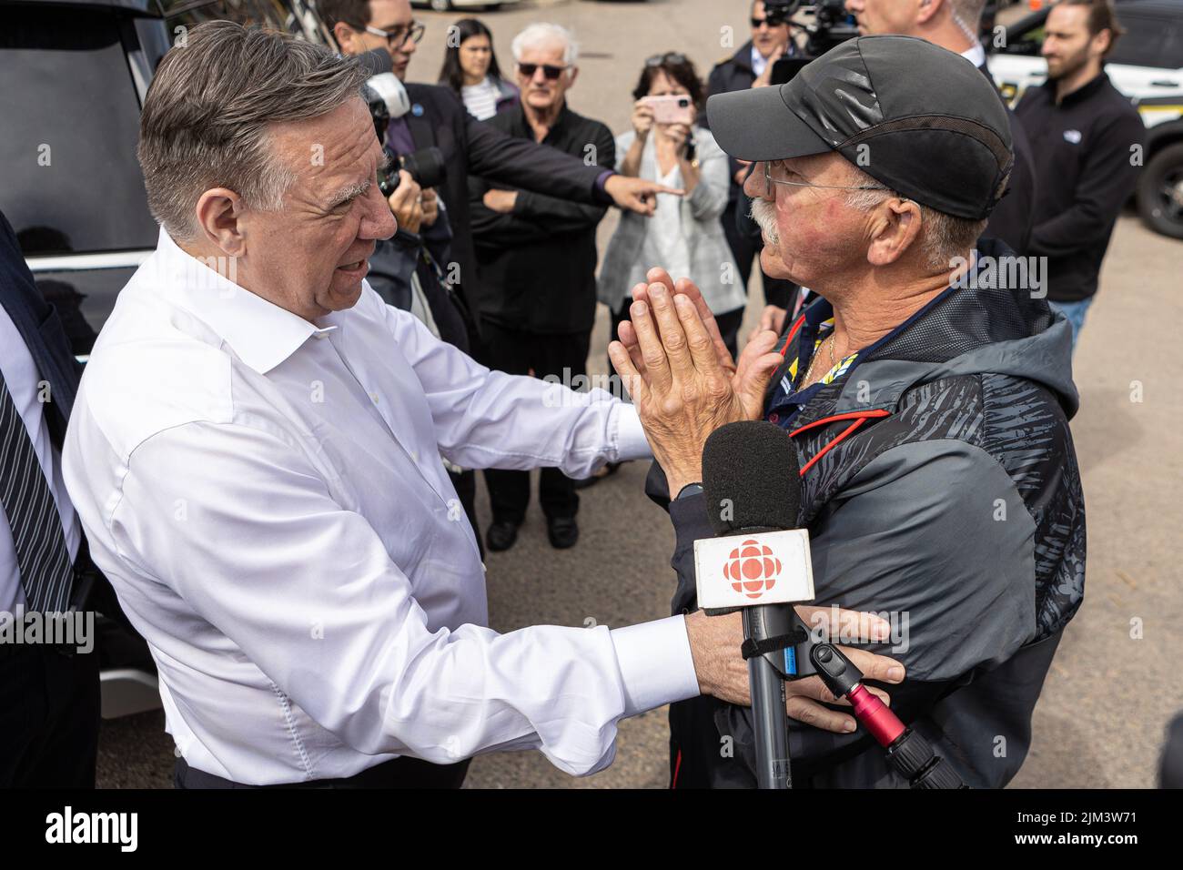 Marius Harvey chats with Quebec Premier Francois Legault following a