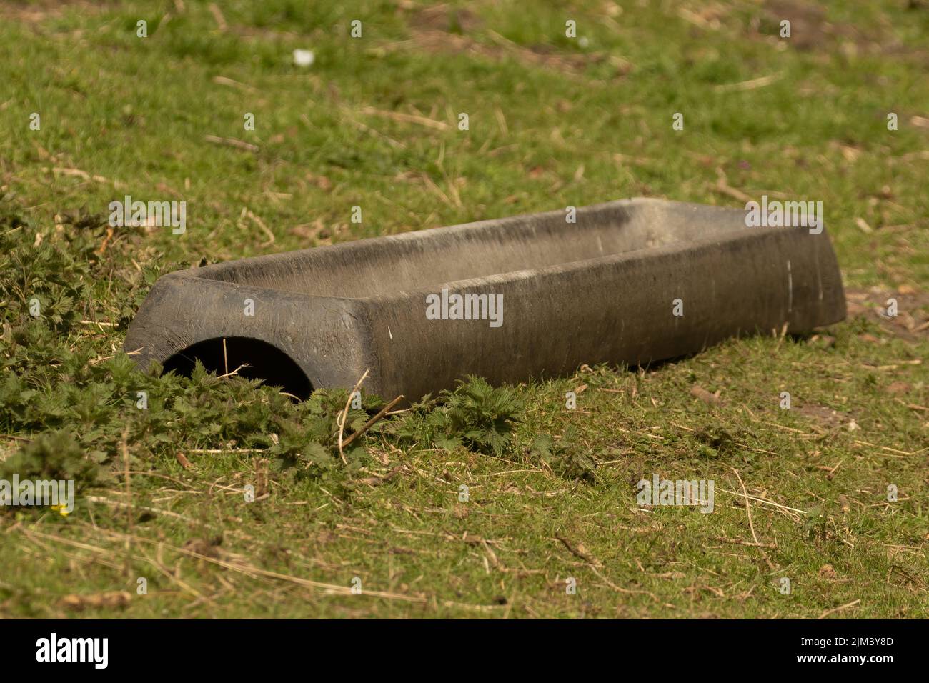 Galvanised metal animal water trough in grass field Stock Photo Alamy