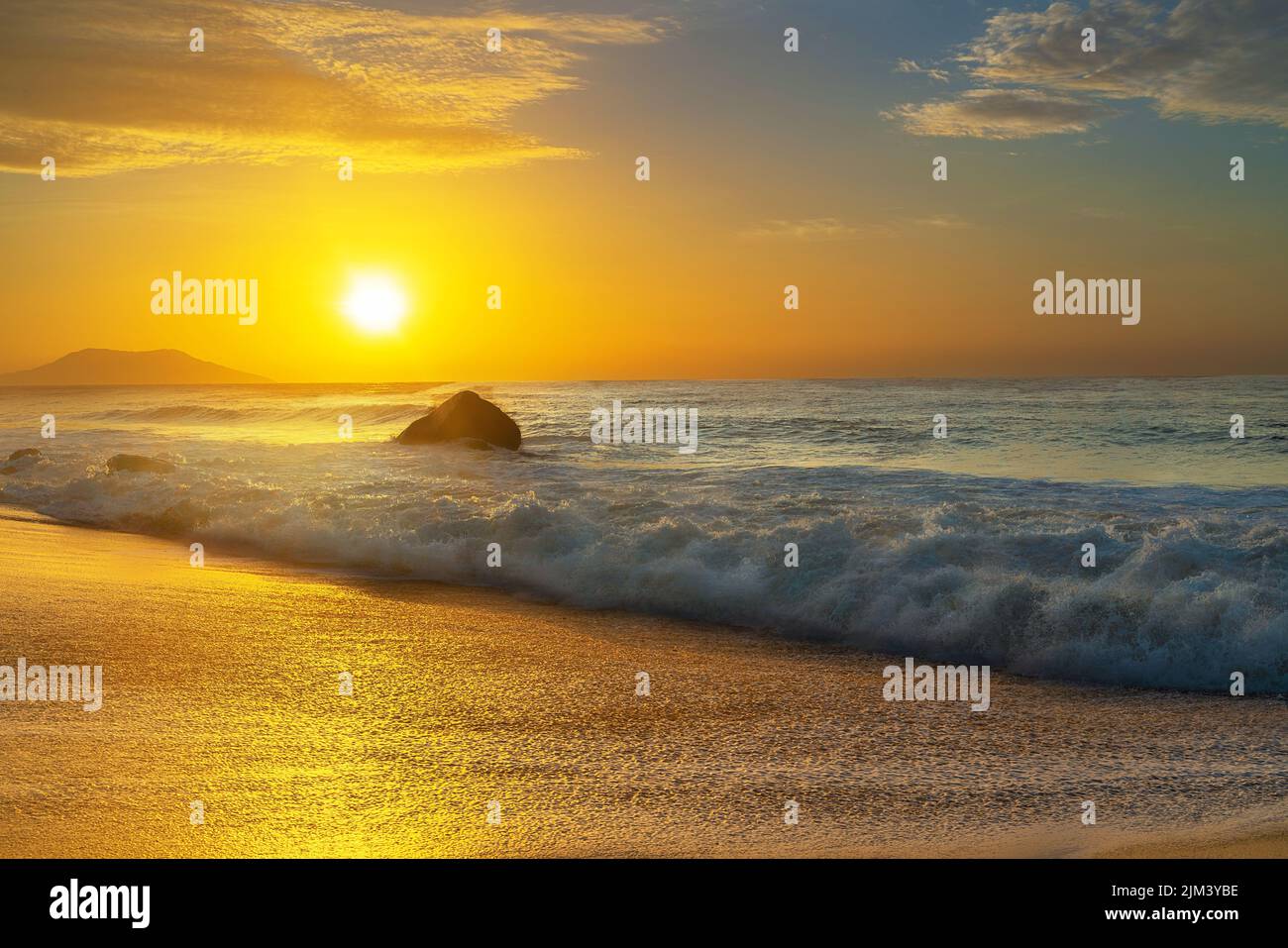 The golden sunset at the beach Stock Photo - Alamy
