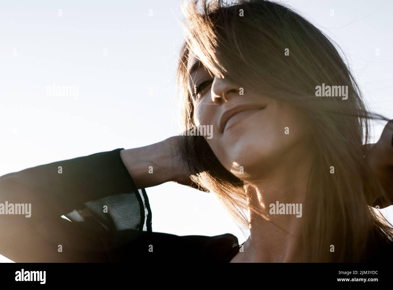 A Romanian woman smiling in sunny weather Stock Photo
