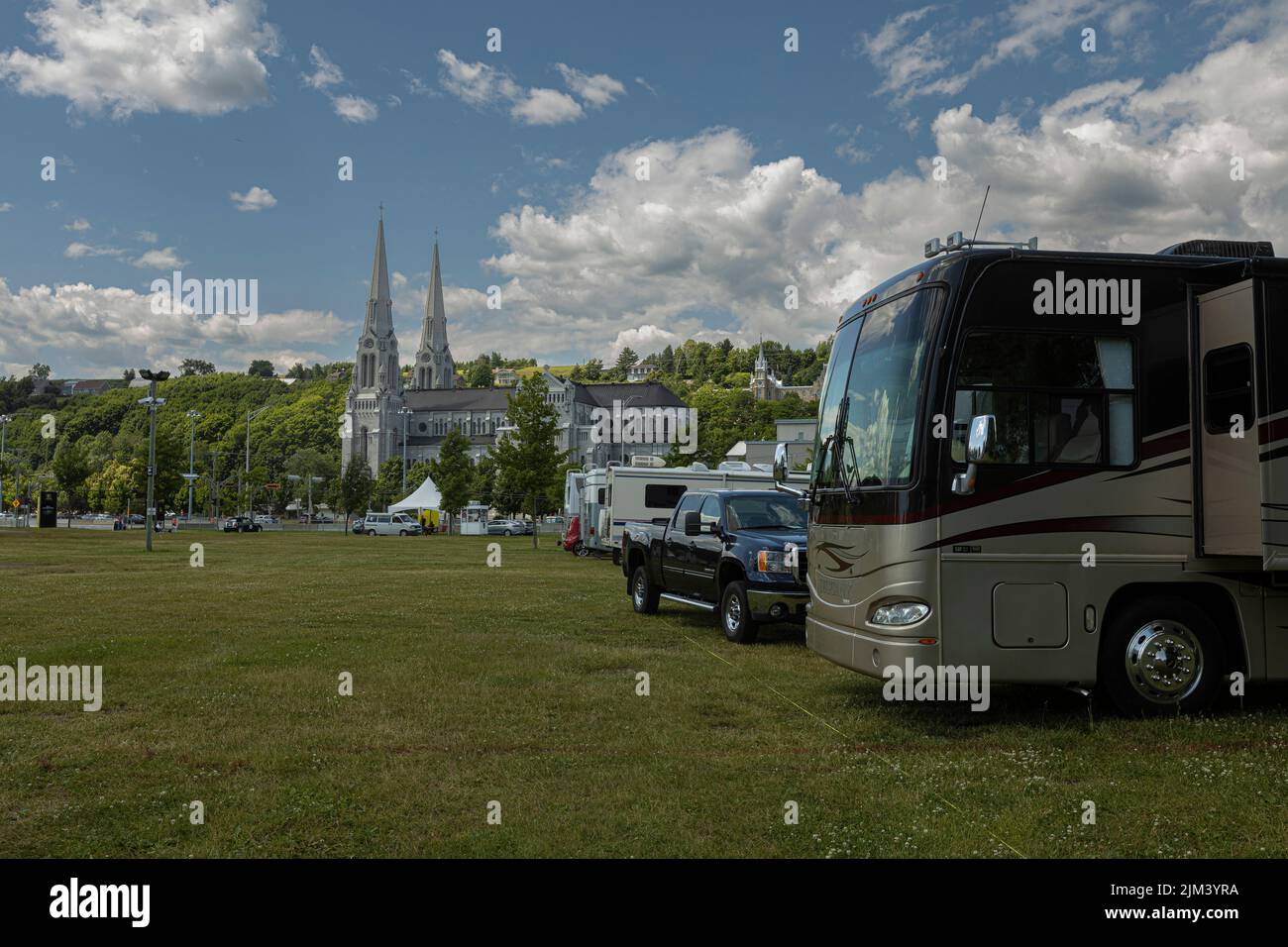 RVs are pictured at a campsite in front of the  Basilica of Sainte-Anne-de-Beaupre, east of Quebec City, Friday July 15, 2022. Stock Photo