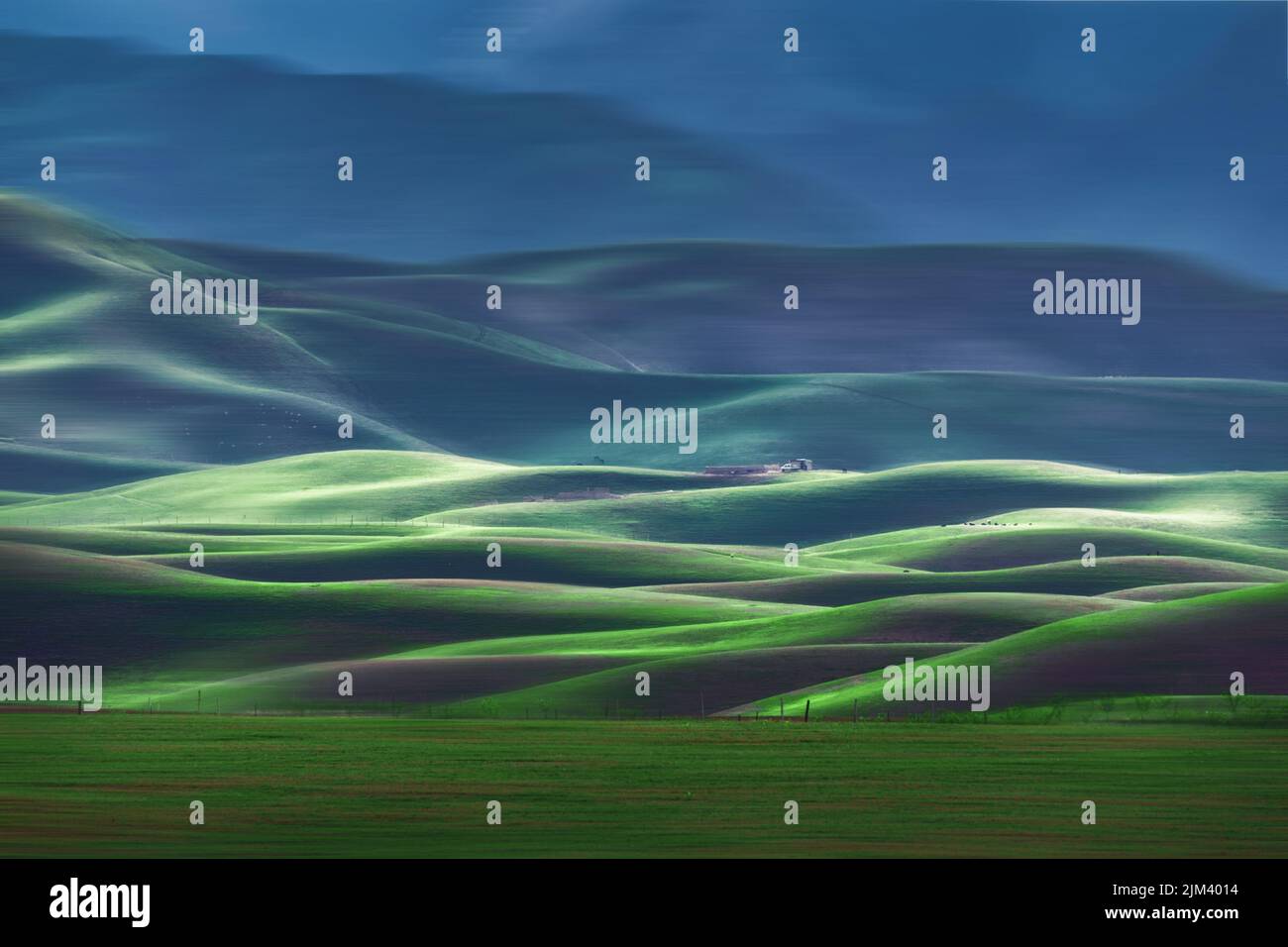 A charming landscape of green valley with endless hills Stock Photo - Alamy