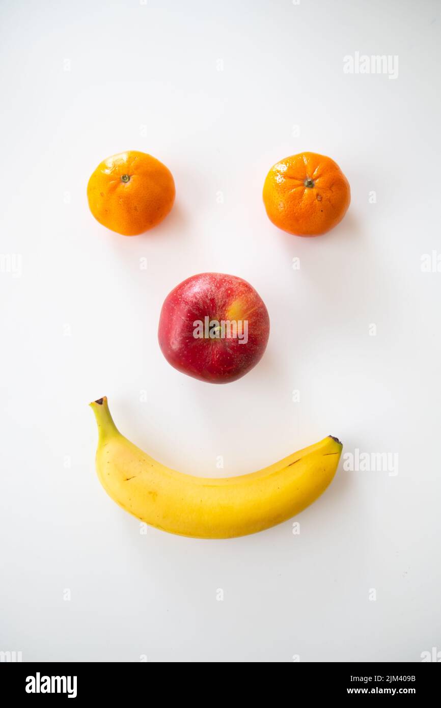 A Vertical Shot Of A Happy Smiley Face Made Out Of Fruits Stock Photo 