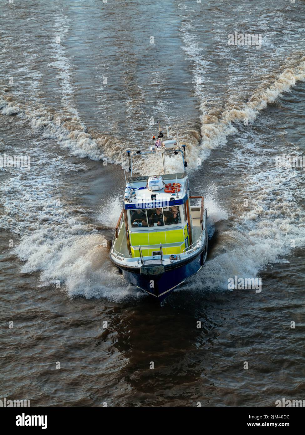 A shot of a metropolitan police boat patrolling the Thames river in London, England, United Kingdom Stock Photo