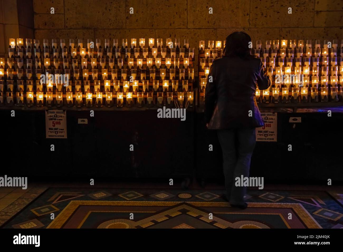 Votive candles are pictured inside the Basilica of Sainte-Anne-de-Beaupre, east of Quebec City, Friday July 15, 2022. Stock Photo
