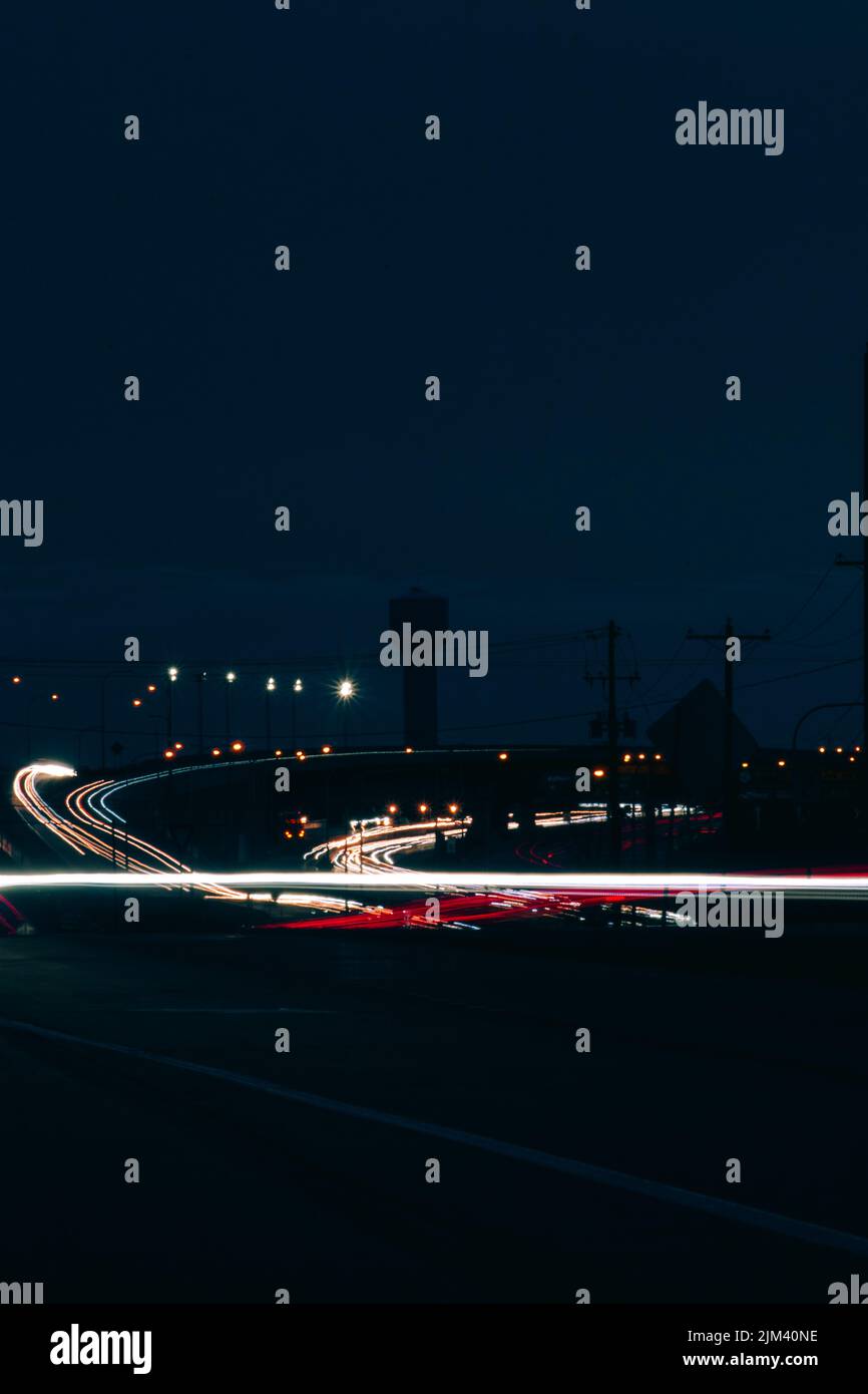 Vertical shot of car light trails on a road at night Stock Photo - Alamy