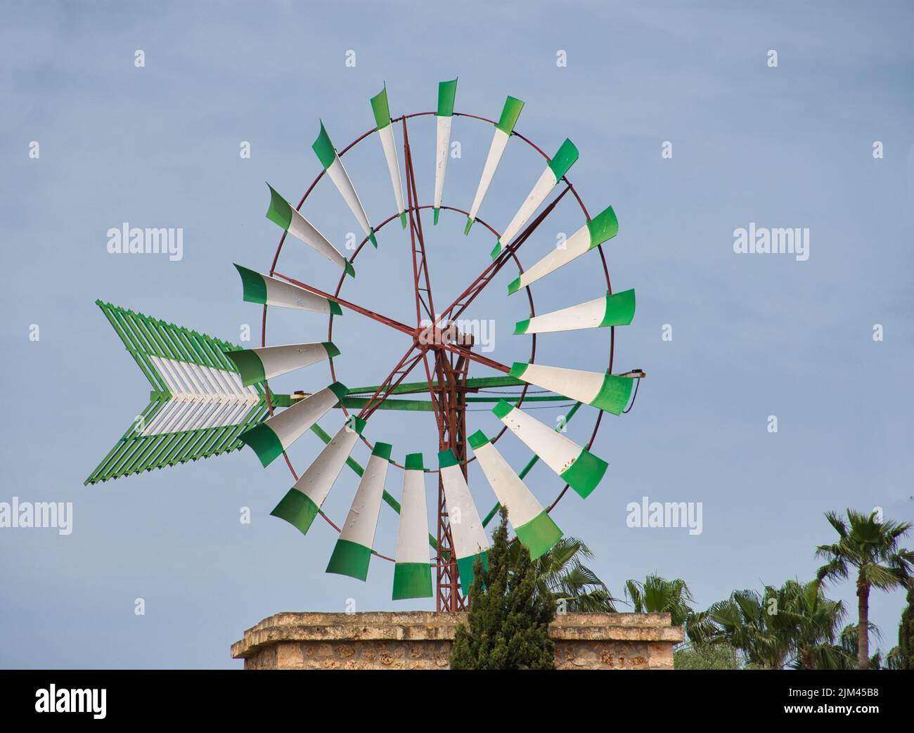 The photo shows one of Mallorca's symbols, a windmill on the roof of a hotel in Sa Coma Stock Photo