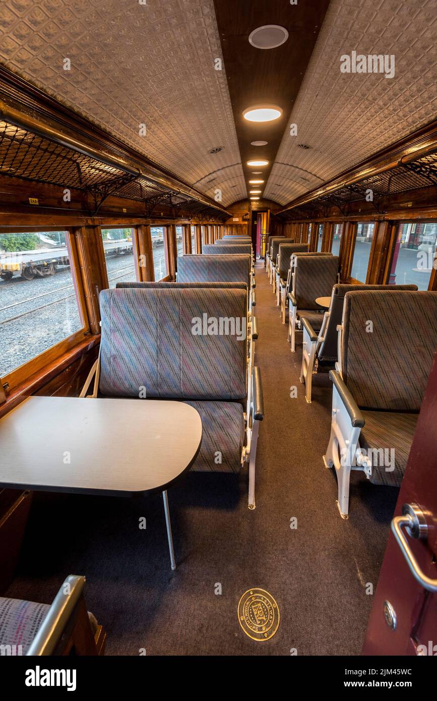 A vertical shot of empty interior of the train for long and short distance in Dunedin,South Island,New Zealand Stock Photo