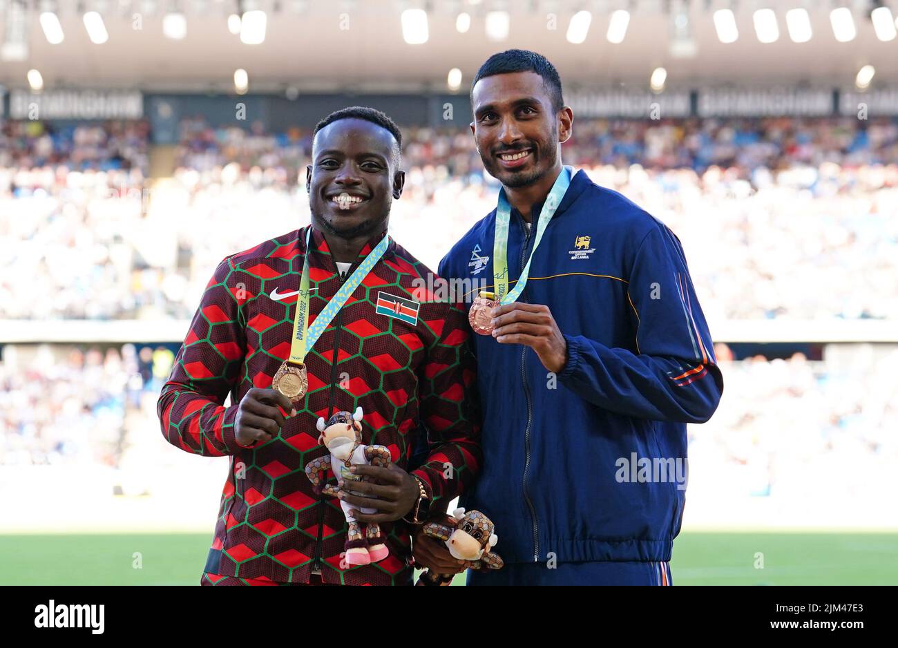 Gold medalist Kenya's Ferdinand Omanyala (left) and bronze medalist Sri Lanka's Yupun Abeykoon on the podium for the Men's Men's 100m, as silver medalist South Africa's Akani Simbine failed to show at Alexander Stadium on day seven of the 2022 Commonwealth Games in Birmingham. Picture date: Thursday August 4, 2022. Stock Photo