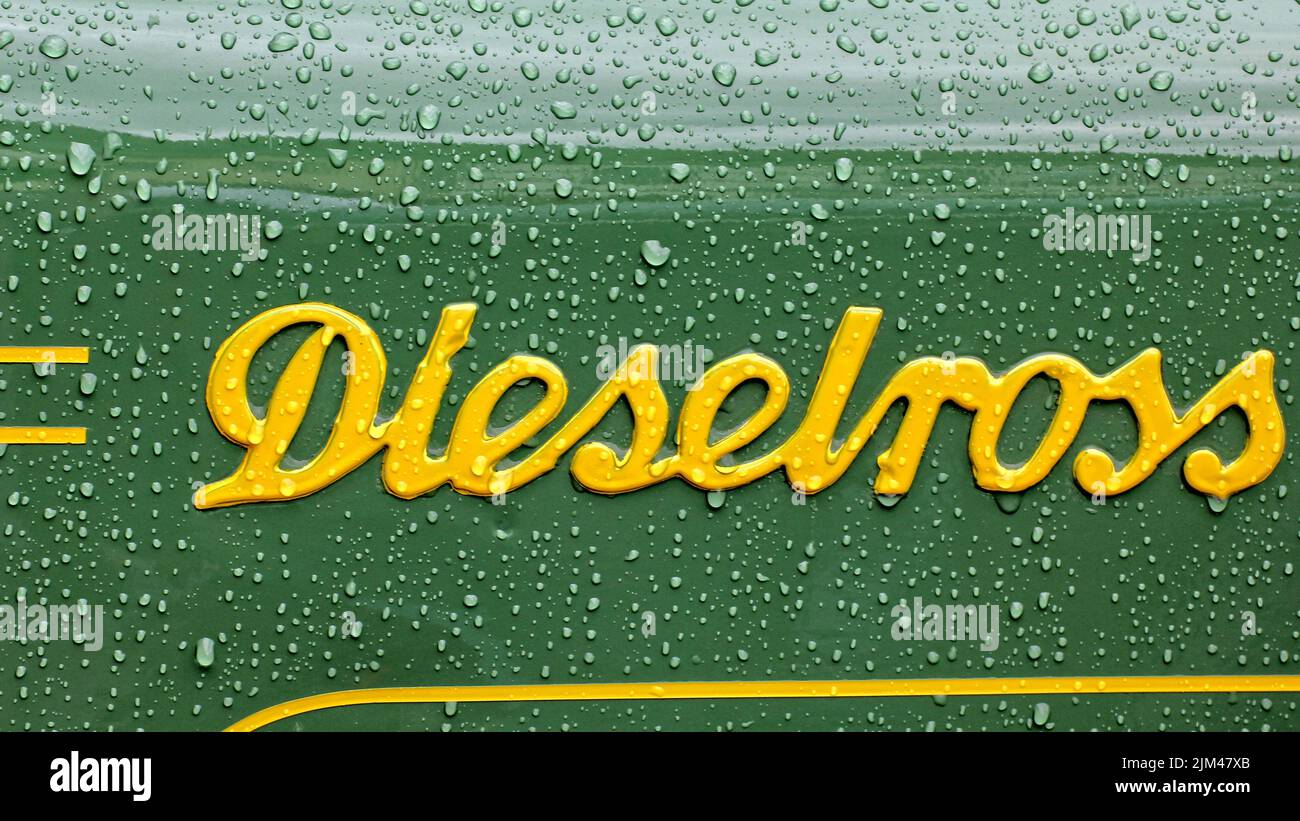 close-up of the yellow lettering on a green backgroundthey were tractors that had been built by fendt since 1930 Stock Photo