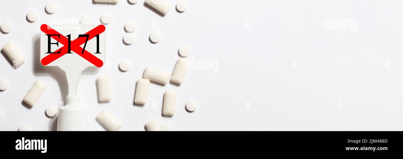 Titanium dioxide, E171, dangerous additive concept. gum, pills