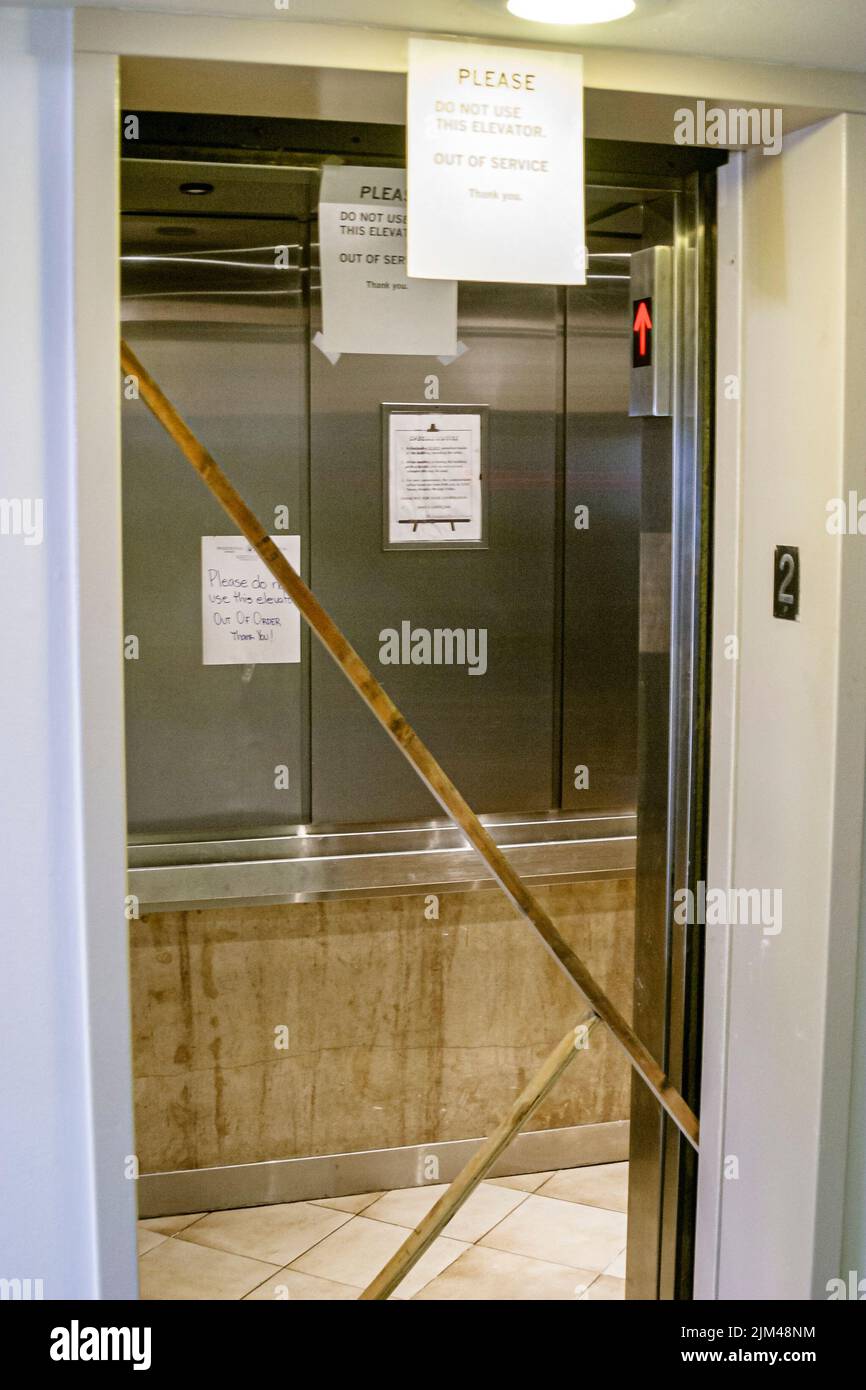 Condominium building inside interior signs warning broken elevator hi