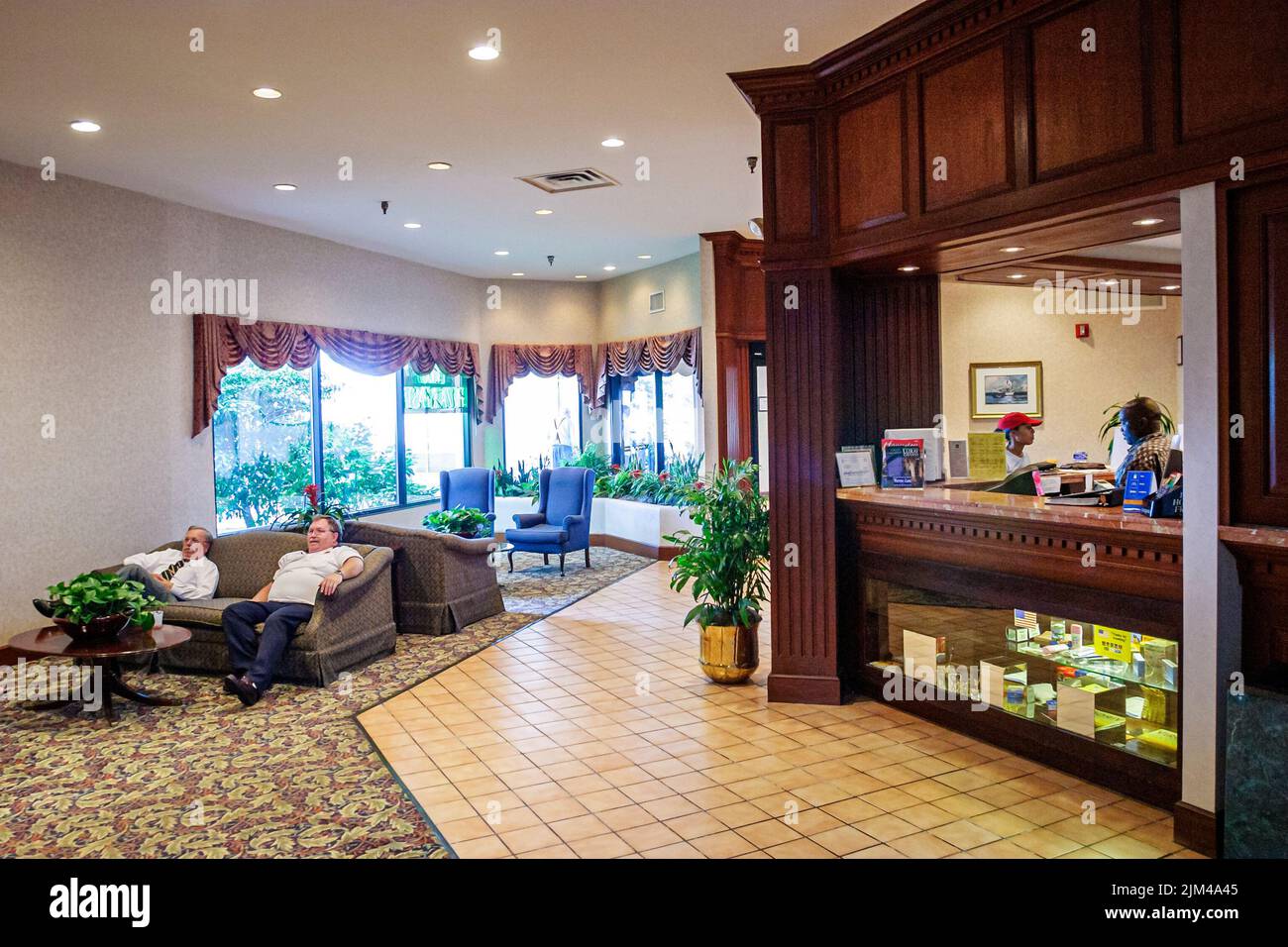 Hampton Virginia,Tidewater Area,Quality Inn hotel hotels lodging inn lobby front desk reservation inside interior,man woman couple people person scene Stock Photo