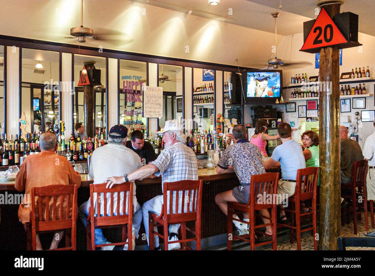 Inside interior bar patrons men group people scene in photo hires