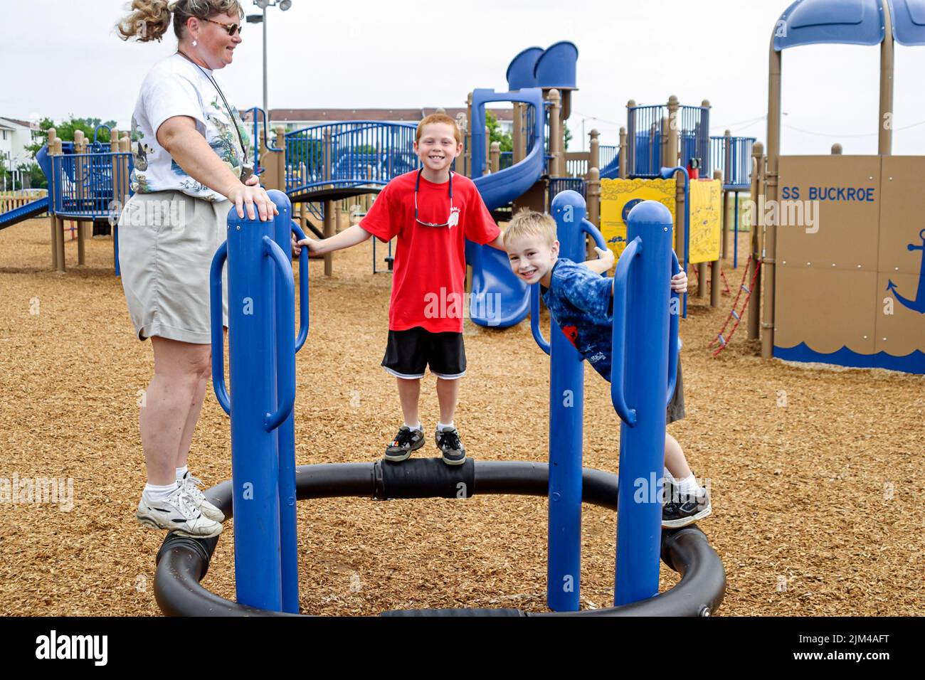 Hampton Virginia,Tidewater Area,Buckroe Beach,park public playground playing boys boy brothers mother sons family,recreation people person Stock Photo