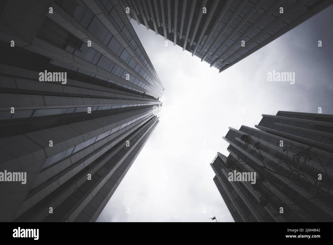 A low angle shot of modern buildings under a cloudy sky Stock Photo - Alamy