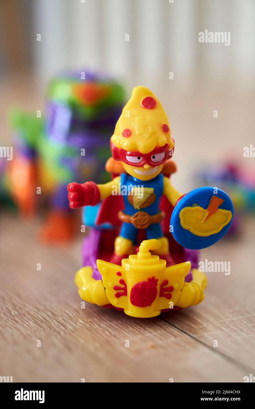 A Super Things Kazoom Kids toy figurines on a wooden table. Stock Photo