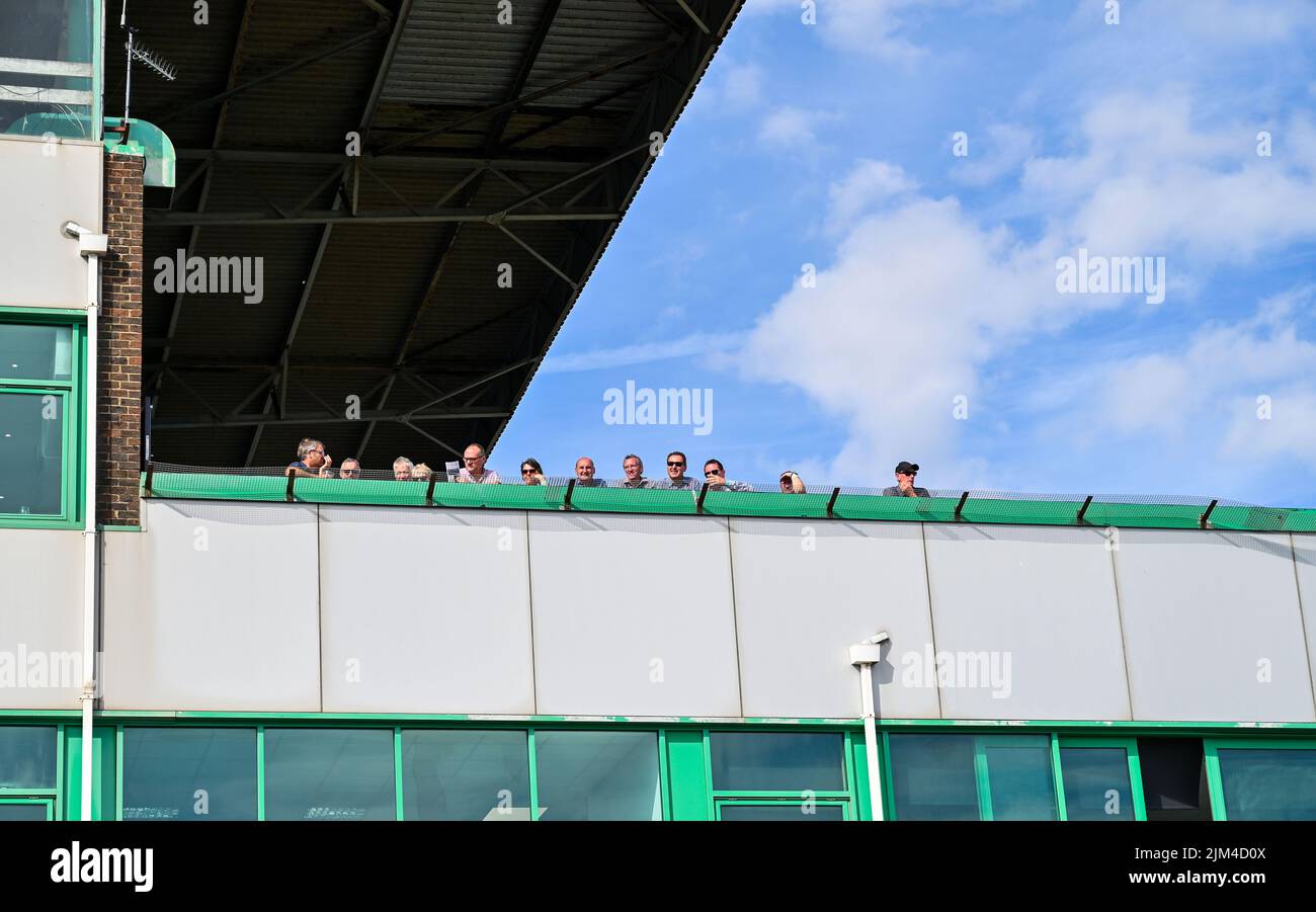 Brighton UK 4th August 2022 - Crowds enjoy the beautiful hot sunny day  at Brighton Racecourse's Ladies Day which is part of The Star Sports Festival of Racing held in August : Credit Simon Dack / Alamy Live News Stock Photo