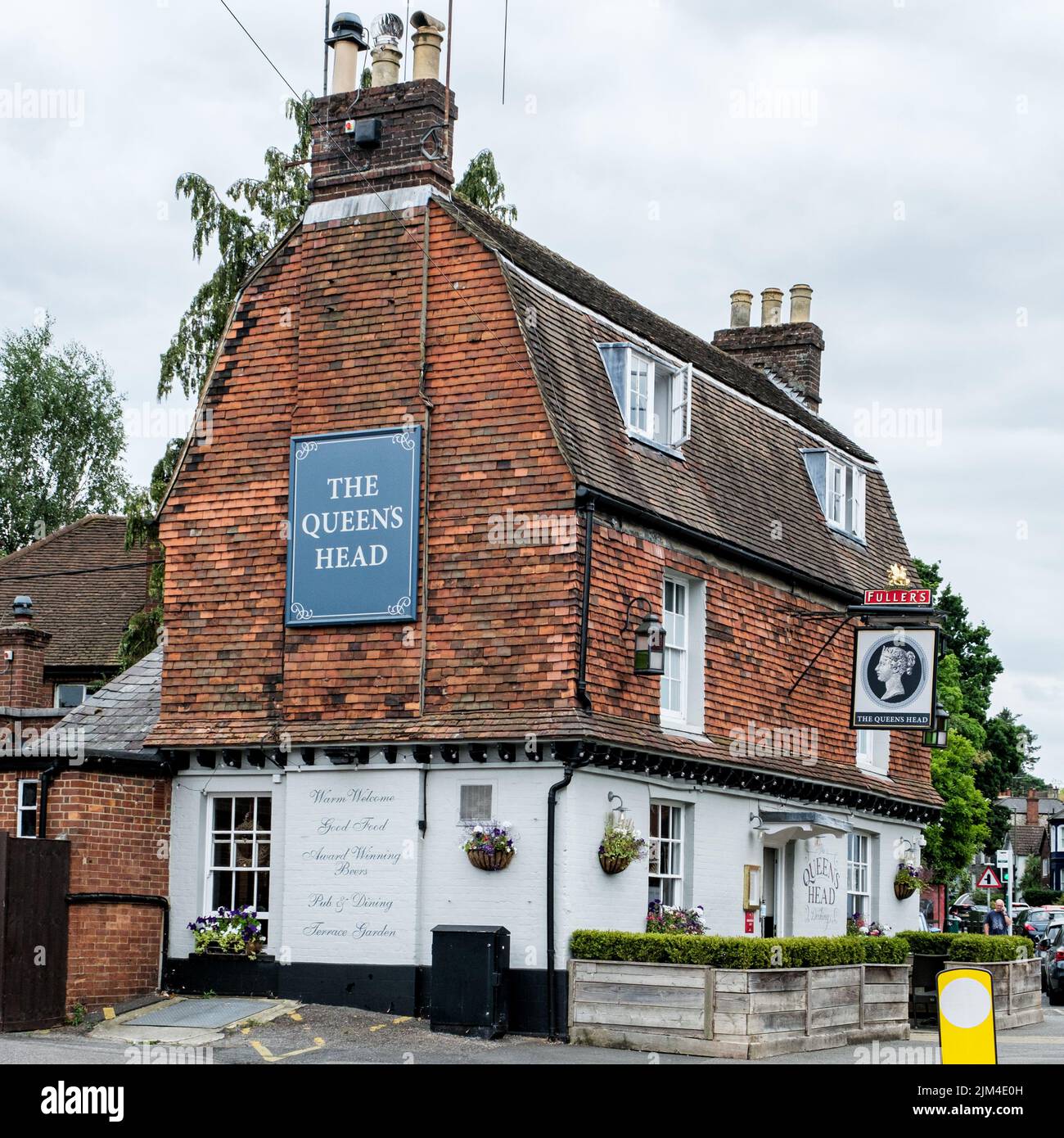 Dorking, Surrey Hills, London UK, June 30 2022, The Queens Head Traditional English Pub Stock Photo