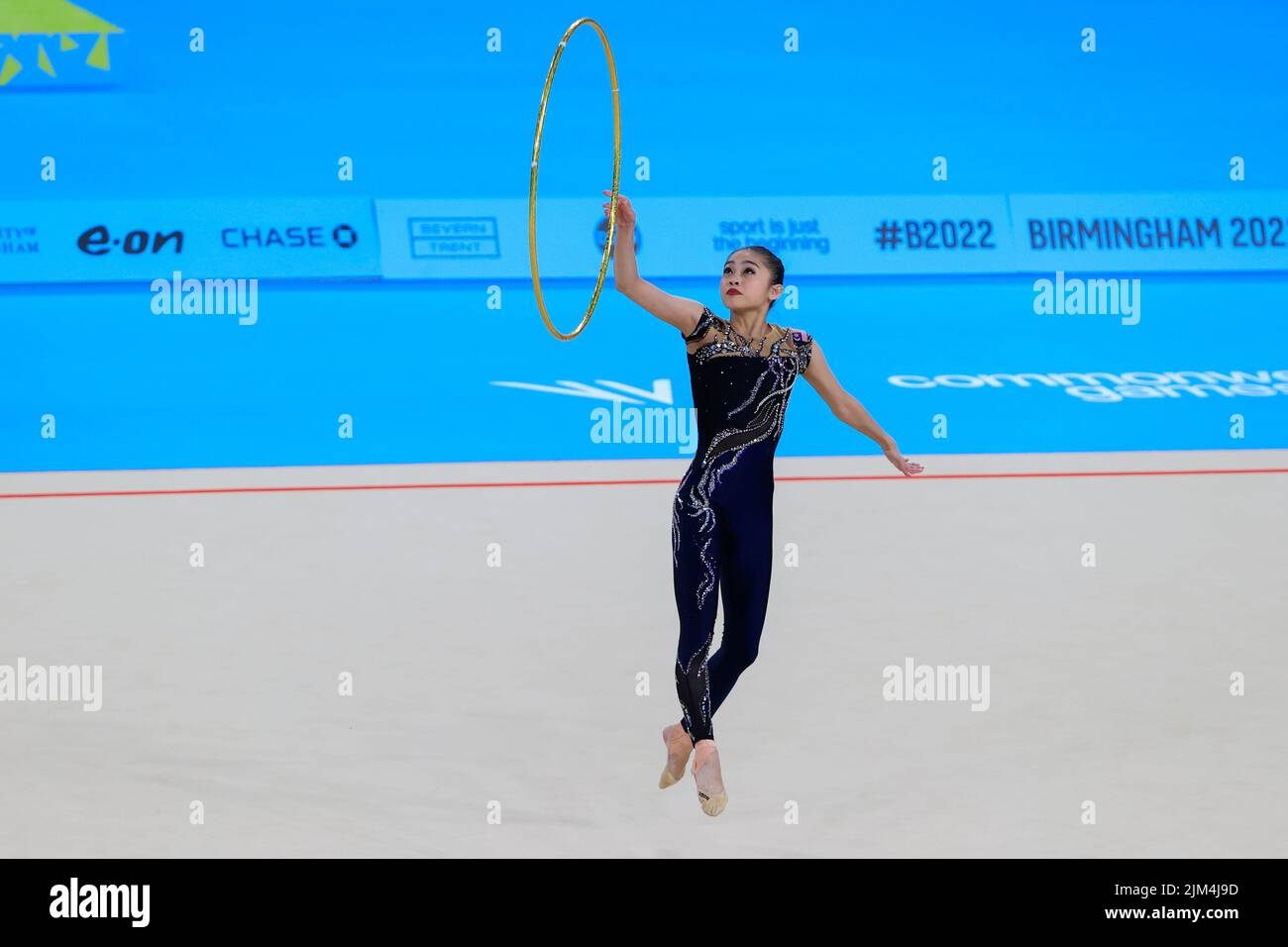 Izzah Binti Amzan of Malaysia performs her hoop routine Stock Photo