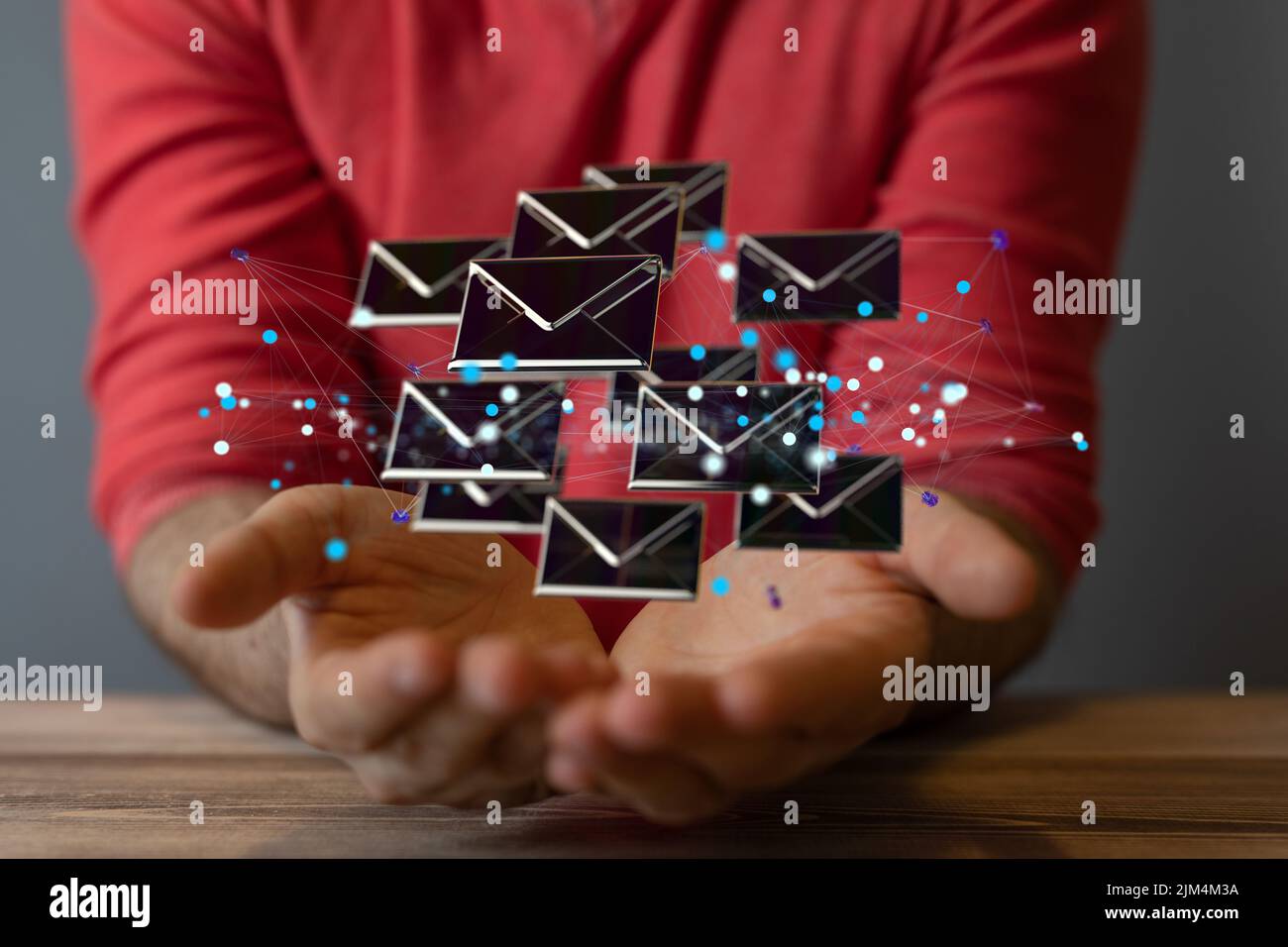 A person's hands with illustrative letter icons floating above hands ...