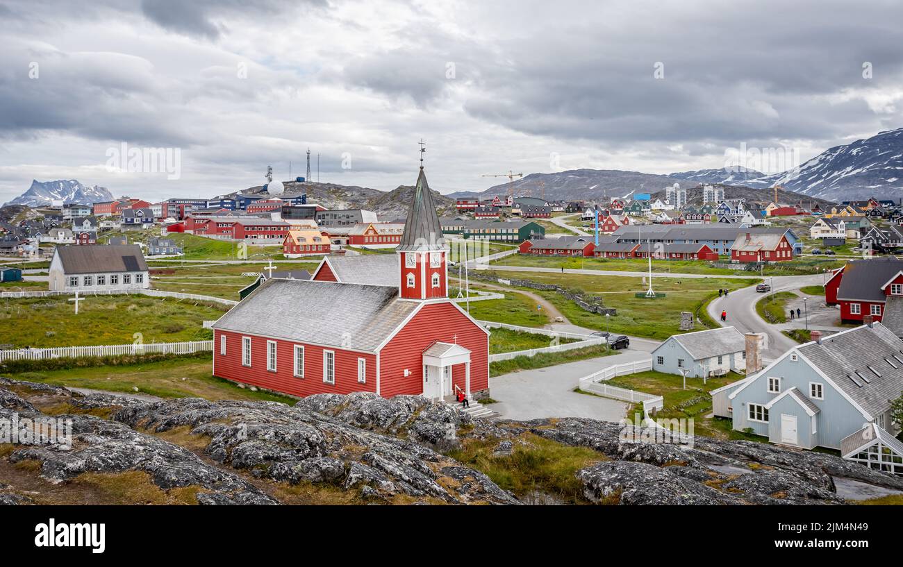 Panoramic view of Church of our Saviour - iconic red wood building and the town of Nuuk in Nuuk, Greenland on 20 July 2022 Stock Photo