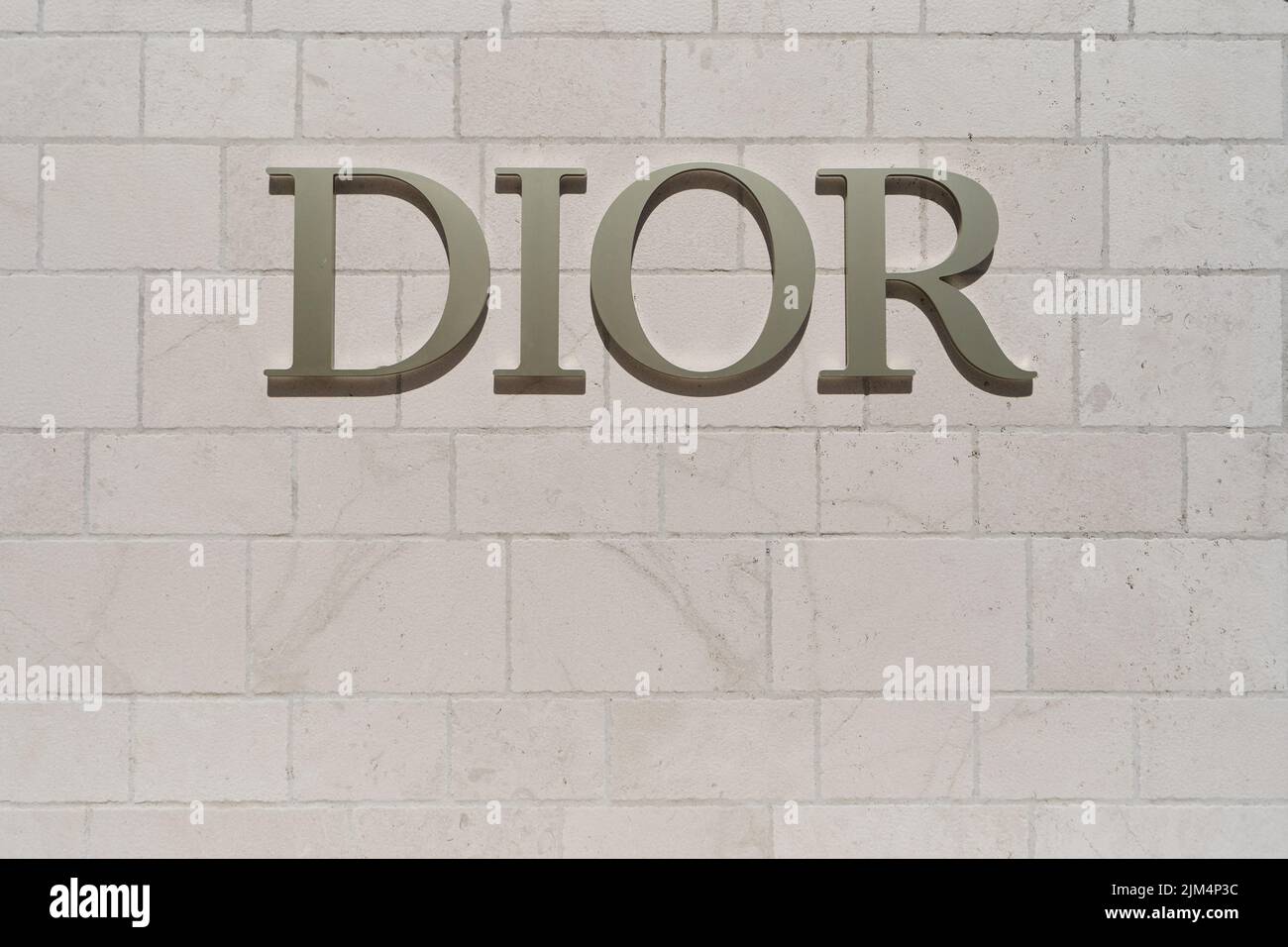Dior signboard on the stone wall Stock Photo