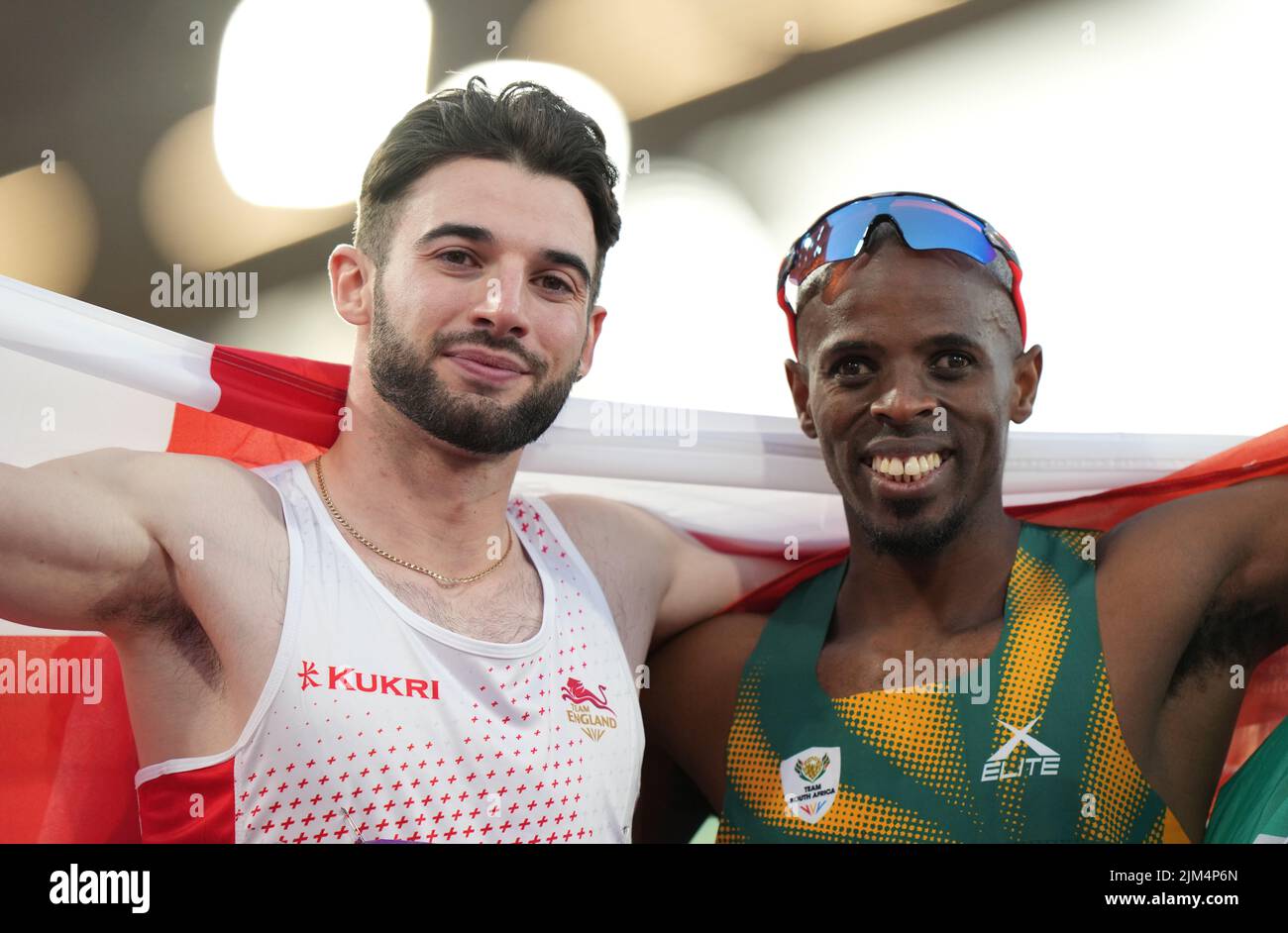 England's Zachary Alexander Shaw (left) celebrates taking silver with winner South Africa's Ndodomzi Jonathan Ntutu after the Men's T11/12 100m Final at Alexander Stadium on day seven of the 2022 Commonwealth Games in Birmingham. Picture date: Thursday August 4, 2022. Stock Photo