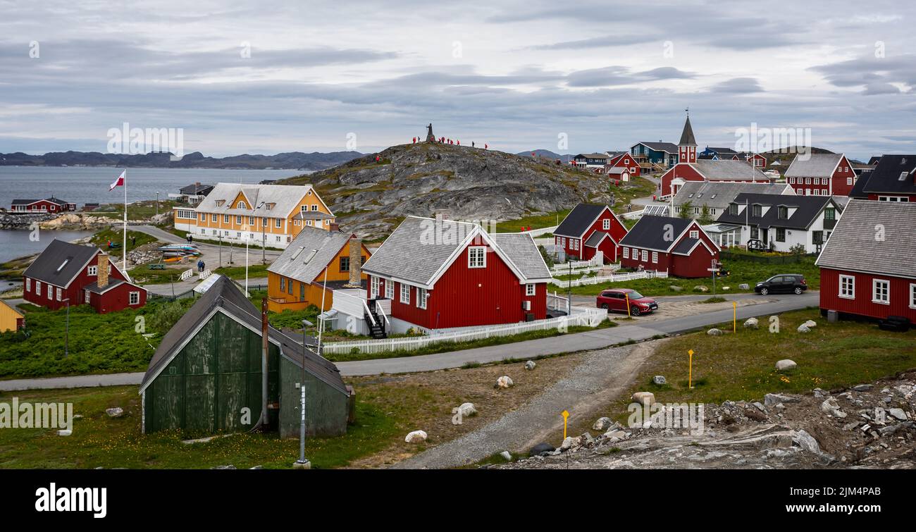 Panoramic view of the Old Colonial Harbour area including the Church of our Saviour and Hans Egede Statue in Nuuk, Greenland on 20 July 2022 Stock Photo