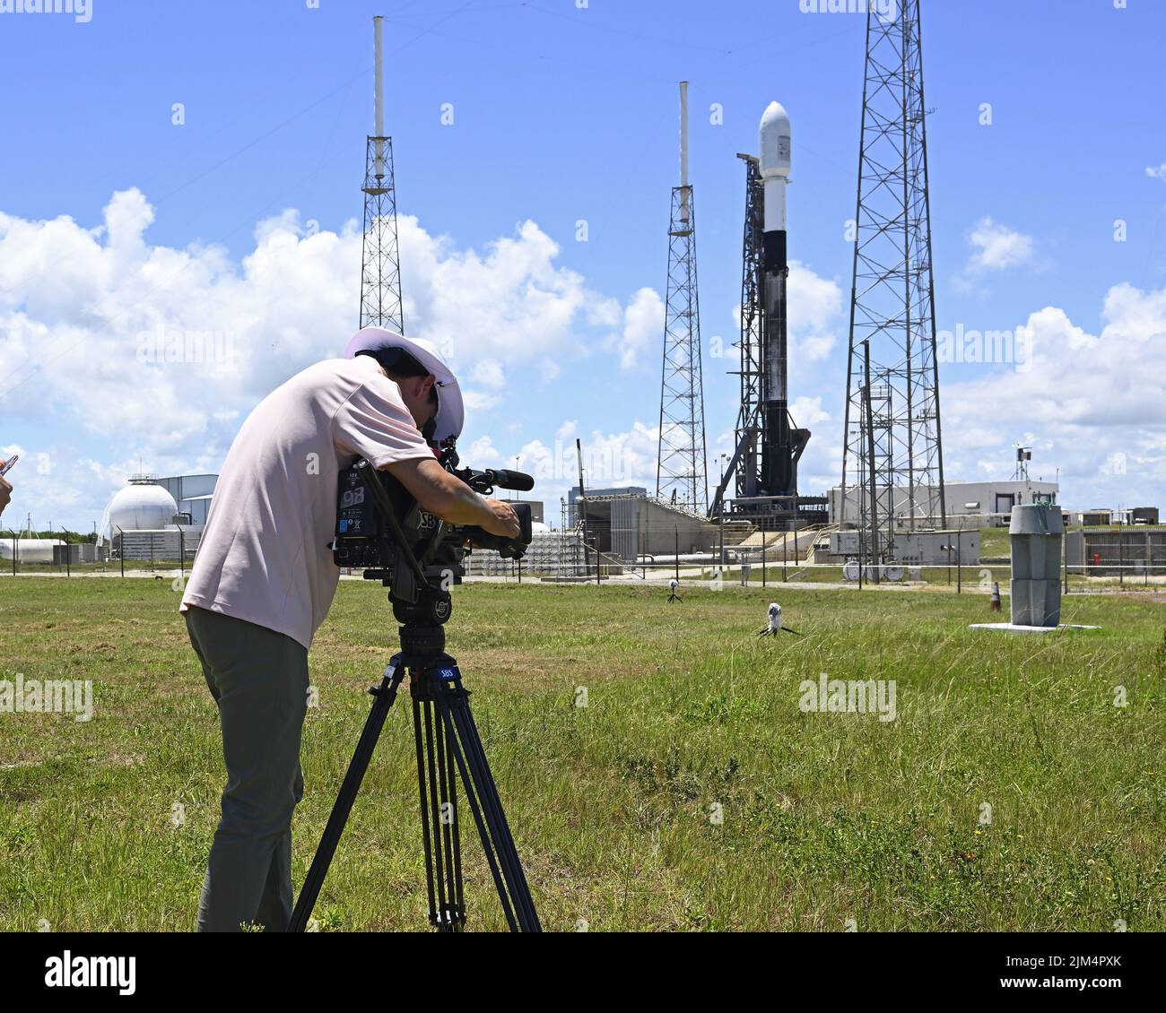 A member of the media from South Korea covers a SpaceX Falcon 9 rocket as it is prepared to launch the Korea Pathfinder Lunar Orbiter (KPLO) from Complex 40 at 7:08 PM from the Cape Canaveral Space Force Station, Florida on Thursday August 4, 2022. South Korea's mission will search for potential areas of water ice on the lunar surface. Photo by Joe Marino/UPI Credit: UPI/Alamy Live News Stock Photo