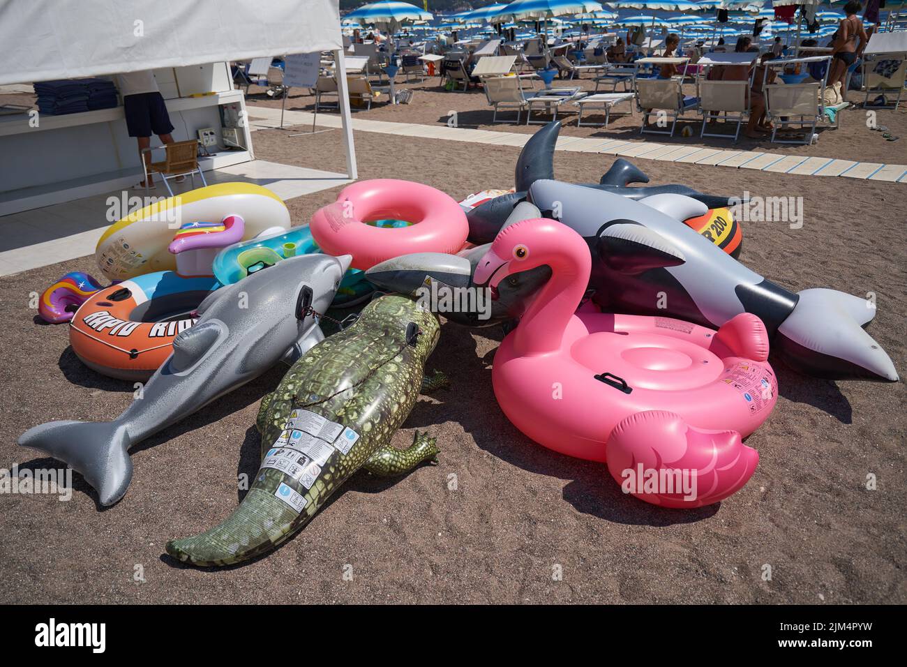 Inflatable animals for rent on the beach Stock Photo