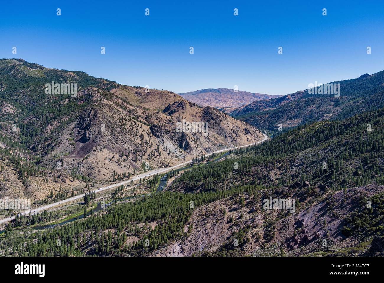 American Highway system runs through a deep canyon in the Sierra Nevada mountains of northern California. Stock Photo