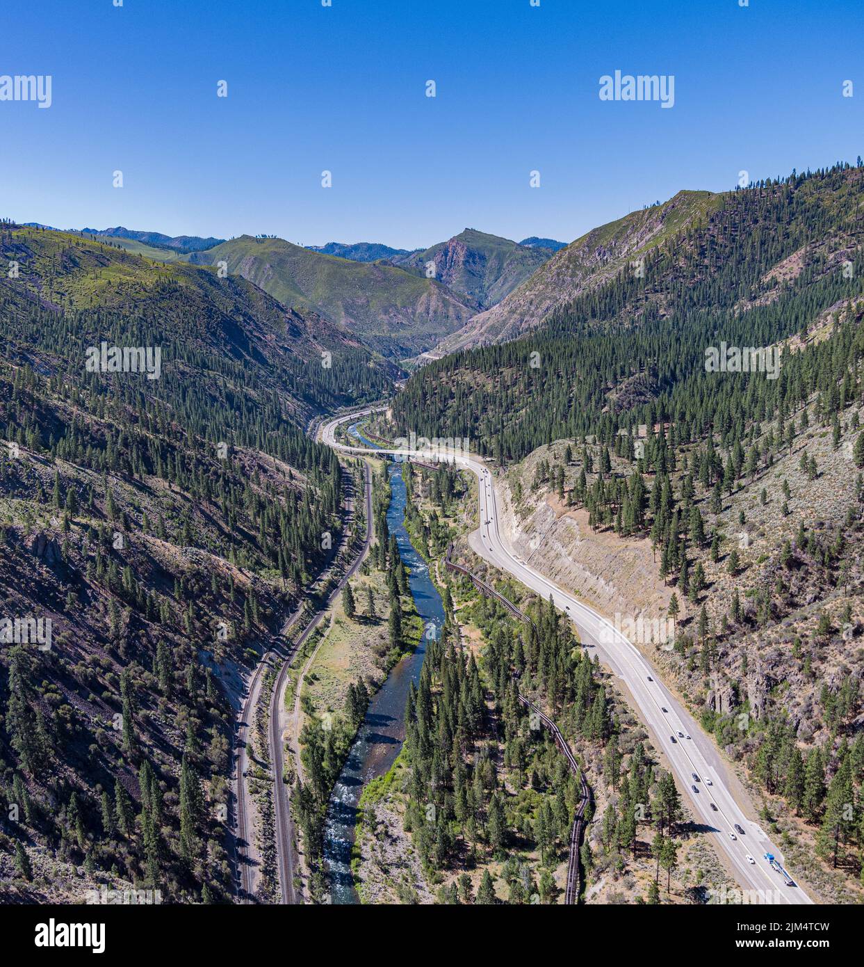 Interstate 80 leads through a deep canyon alongside the Truckee River and Transcontinental Railroad in northern California. Stock Photo