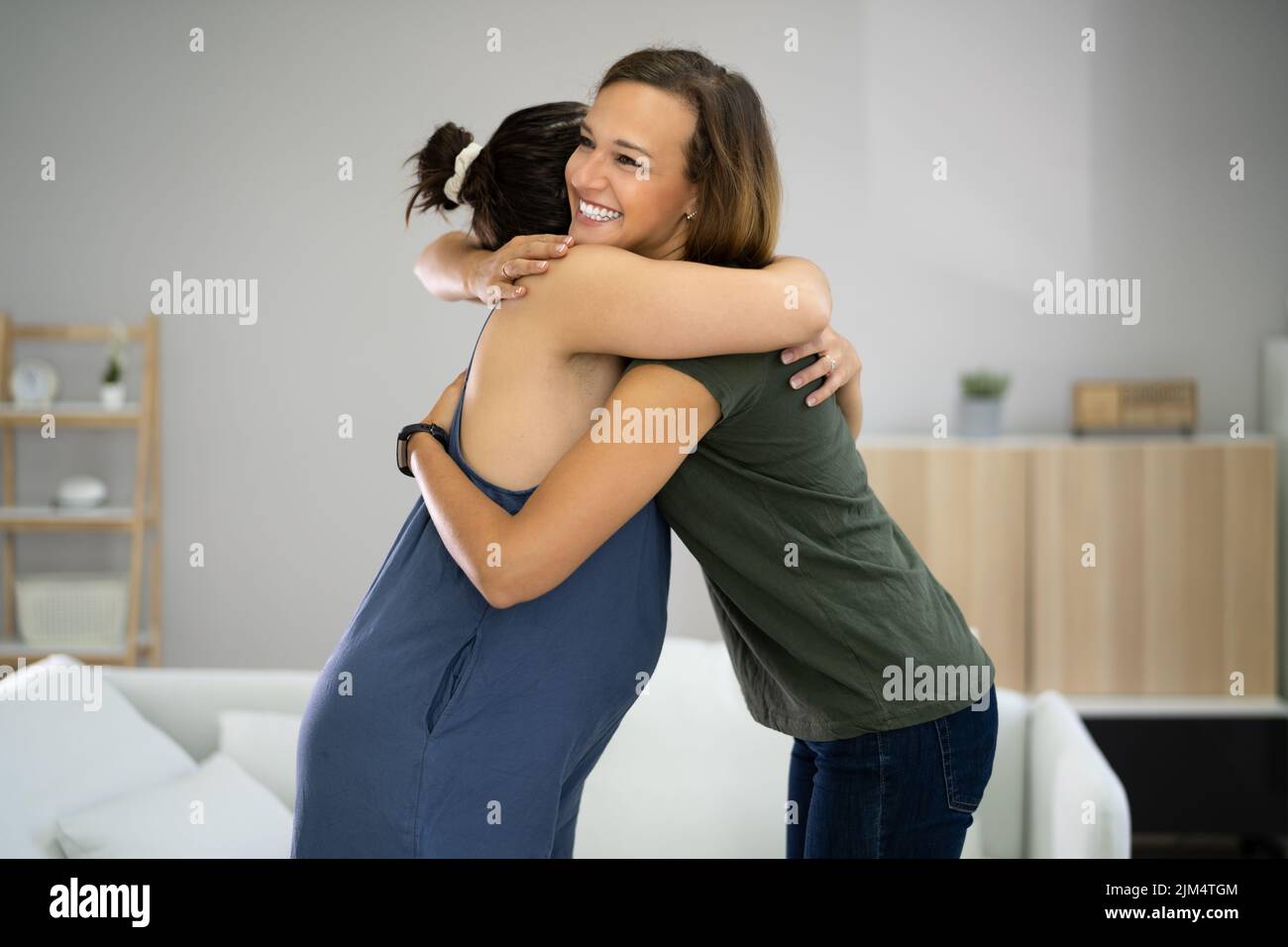 Women hugging hi-res stock photography and images - Alamy