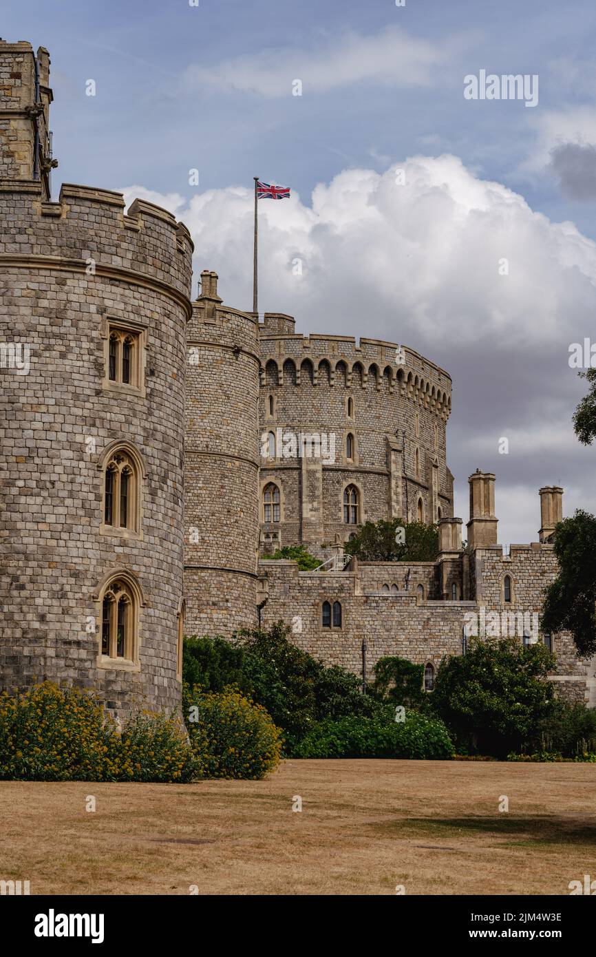 The Round Tower at Windsor Castle with Union Flag swaying in the wind Stock Photo