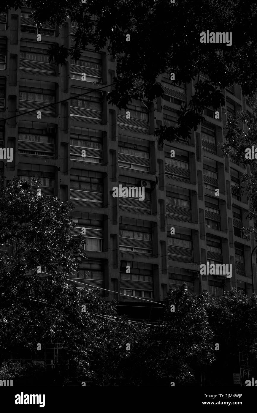A vertical grayscale shot of the building facade Stock Photo - Alamy
