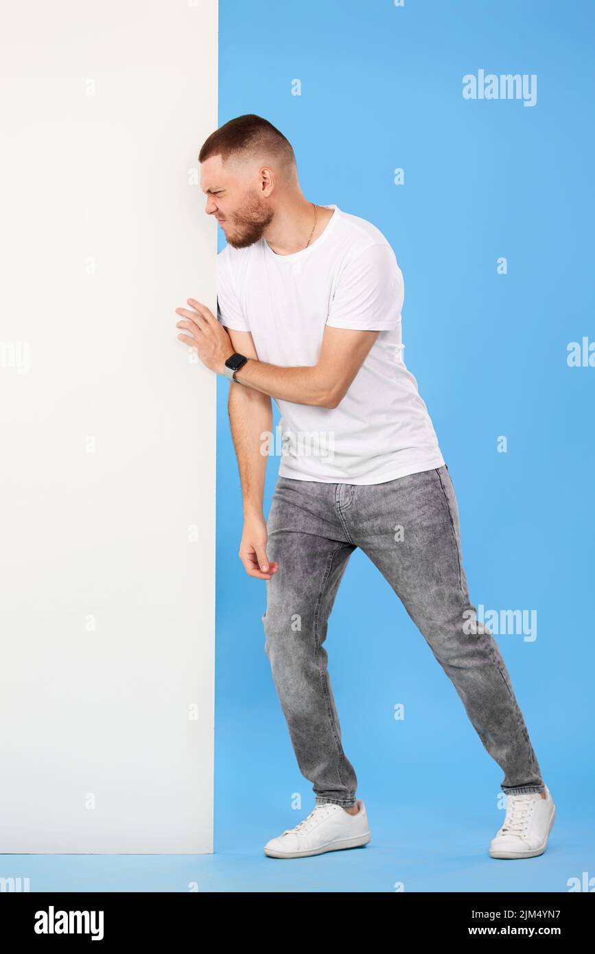 cheerful man holding board with empty copy space Stock Photo