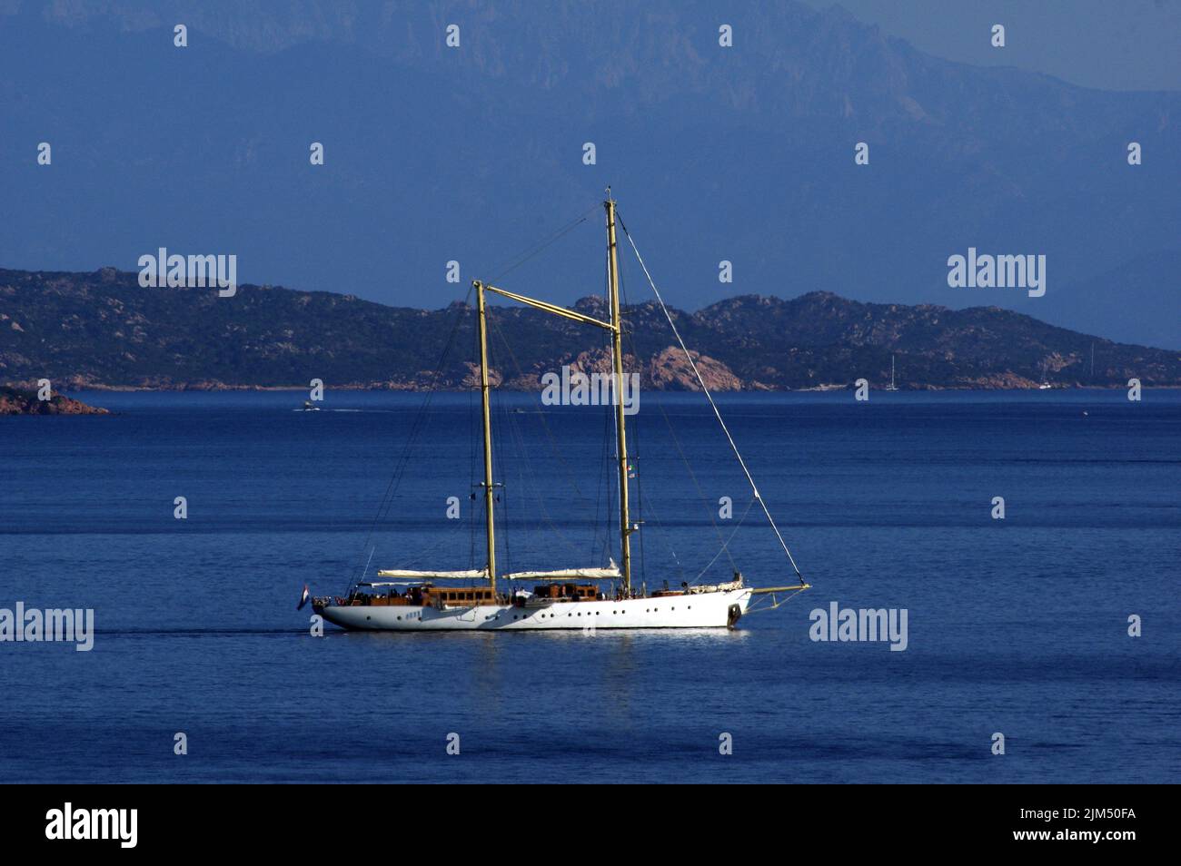 Luxury sailboat Chronos anchoring at Porto Rafael Bay, Palau, Sardinai, Italy Stock Photo