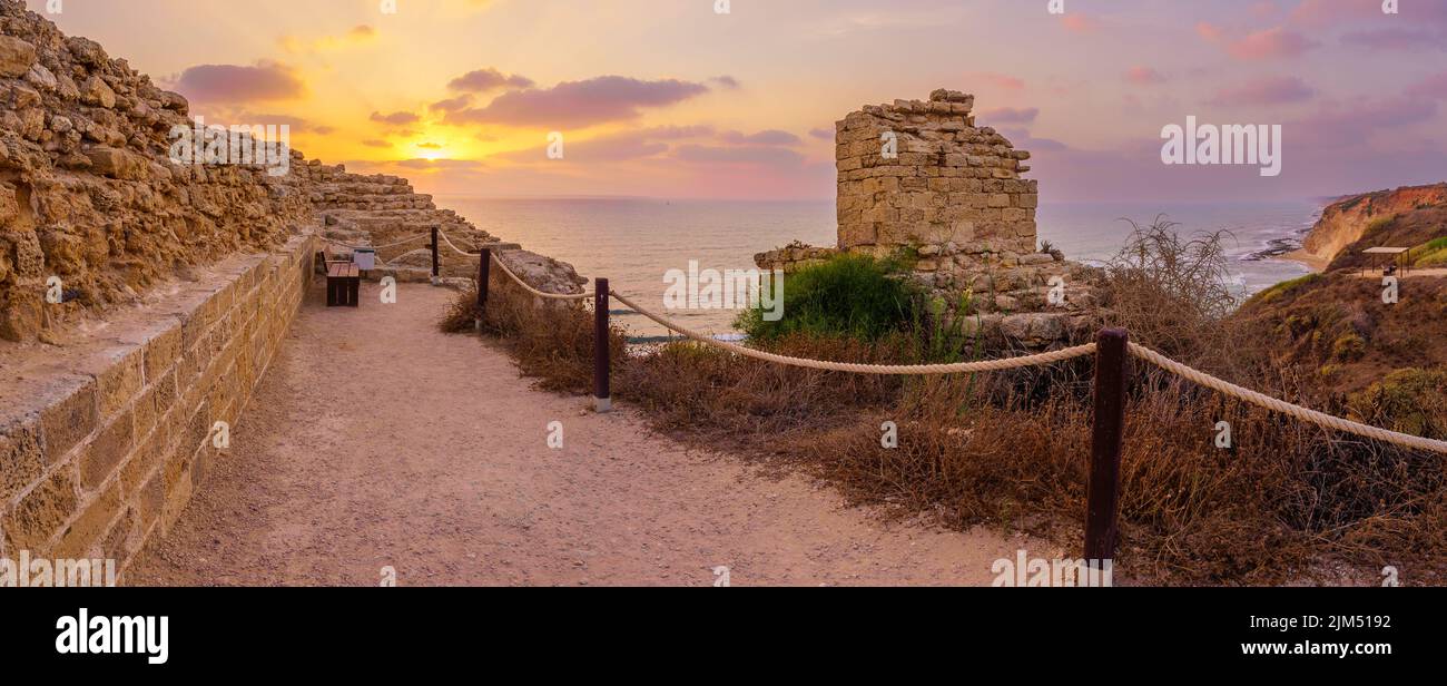Panoramic sunset view of the crusader fortress and the Mediterranean Sea coast, in Apollonia National Park, Herzliya, central Israel Stock Photo